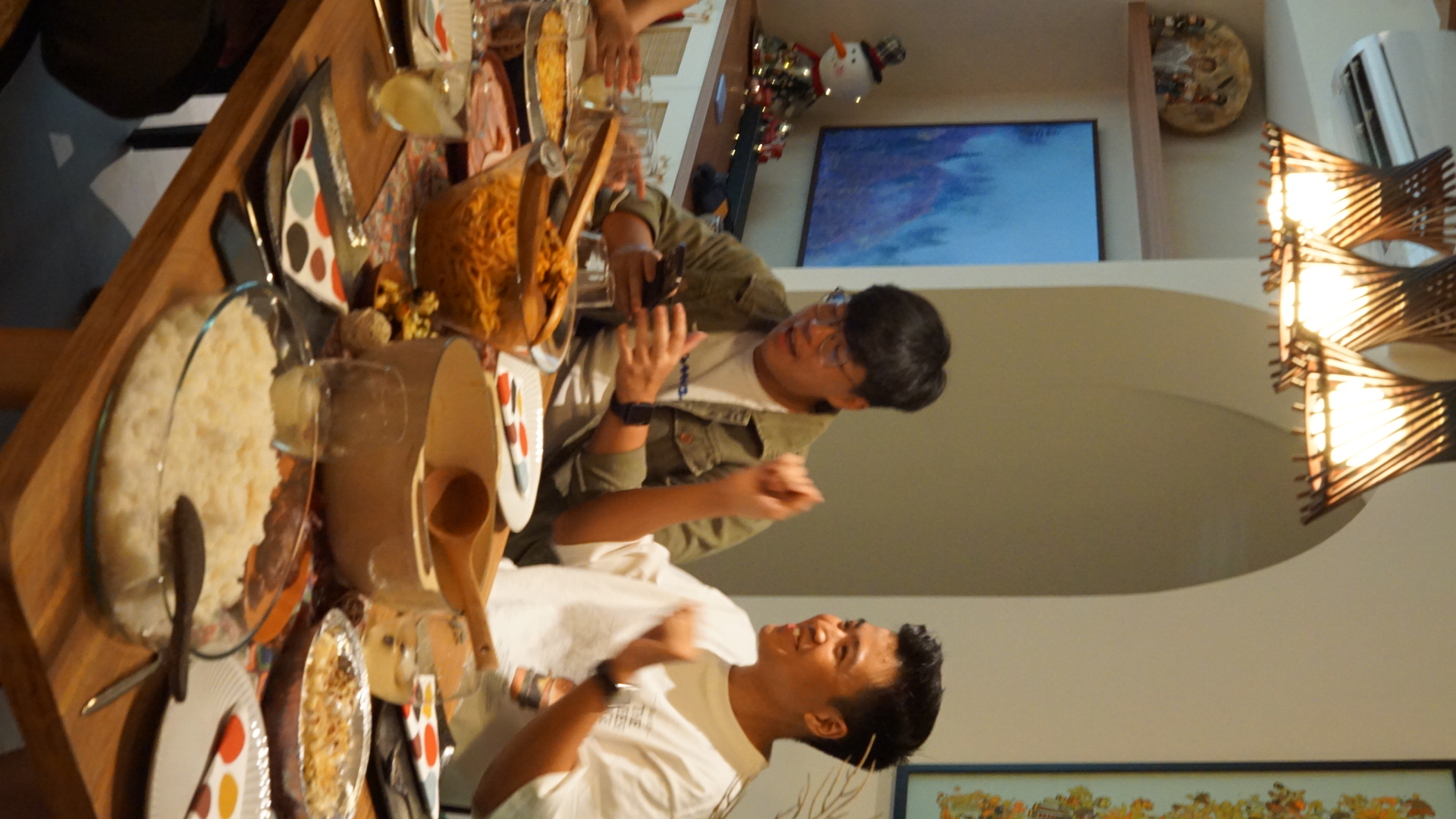 Dining Area Tour: Perfect for Hosting! - Family gathering, table setting, festive atmosphere, colorful plates, rice dish