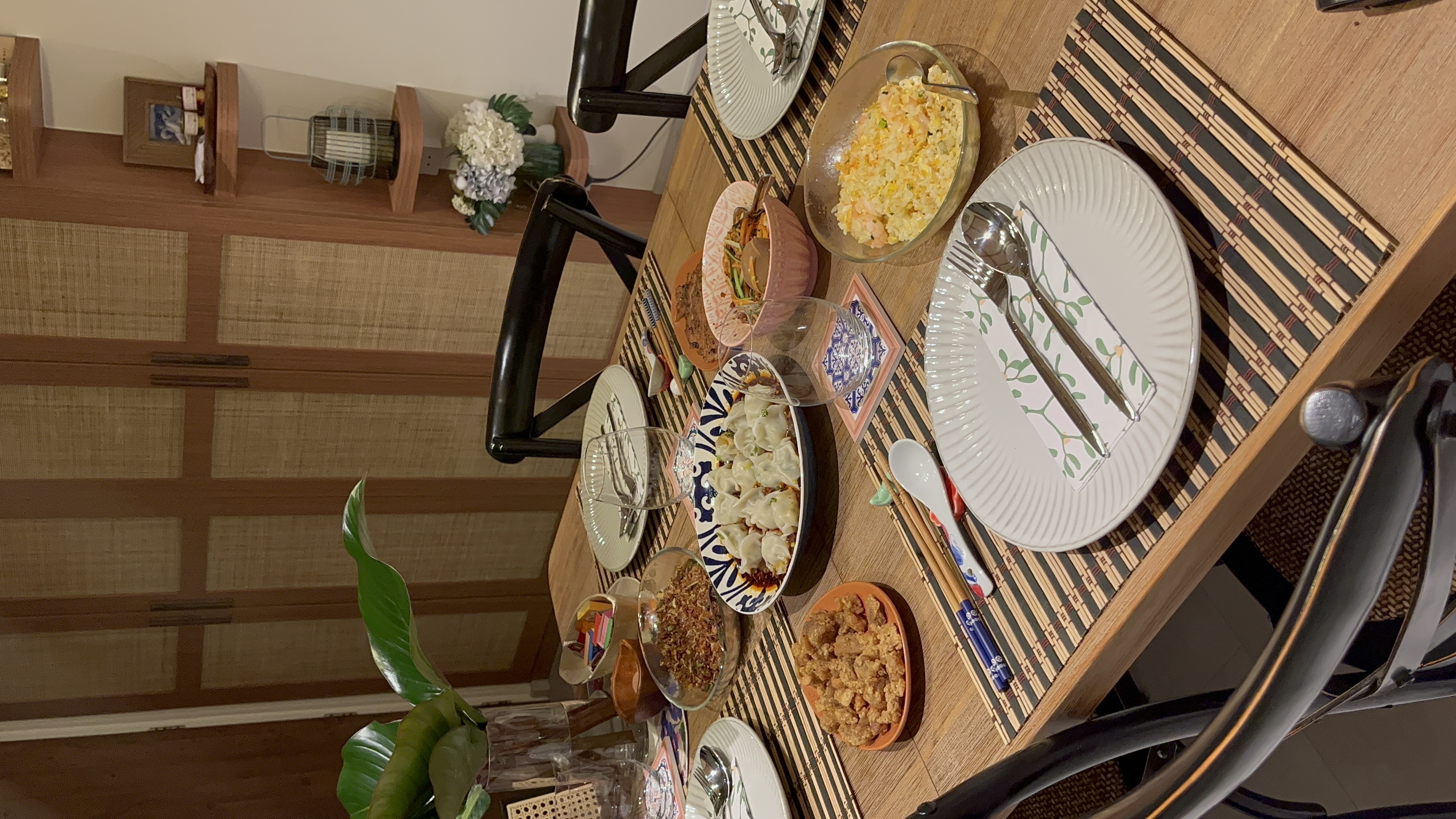 Dining Area Tour: Perfect for Hosting! - bamboo dining table, traditional Asian cuisine, wooden cabinet, woven placemats