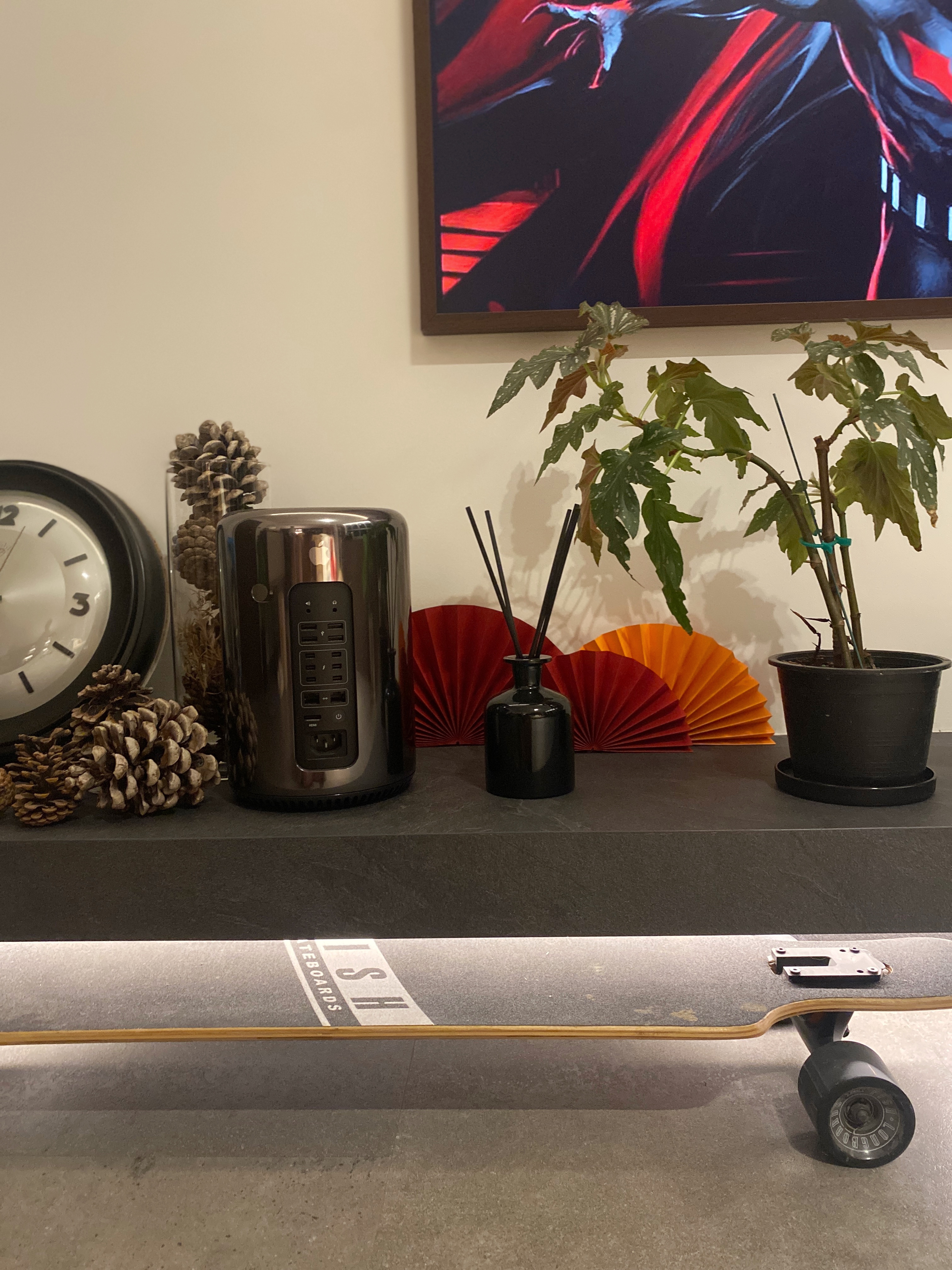 Trying not to lose the CNY essence with our contemporary CNY deco - smartphone, clock, decorative items, potted plant, pine