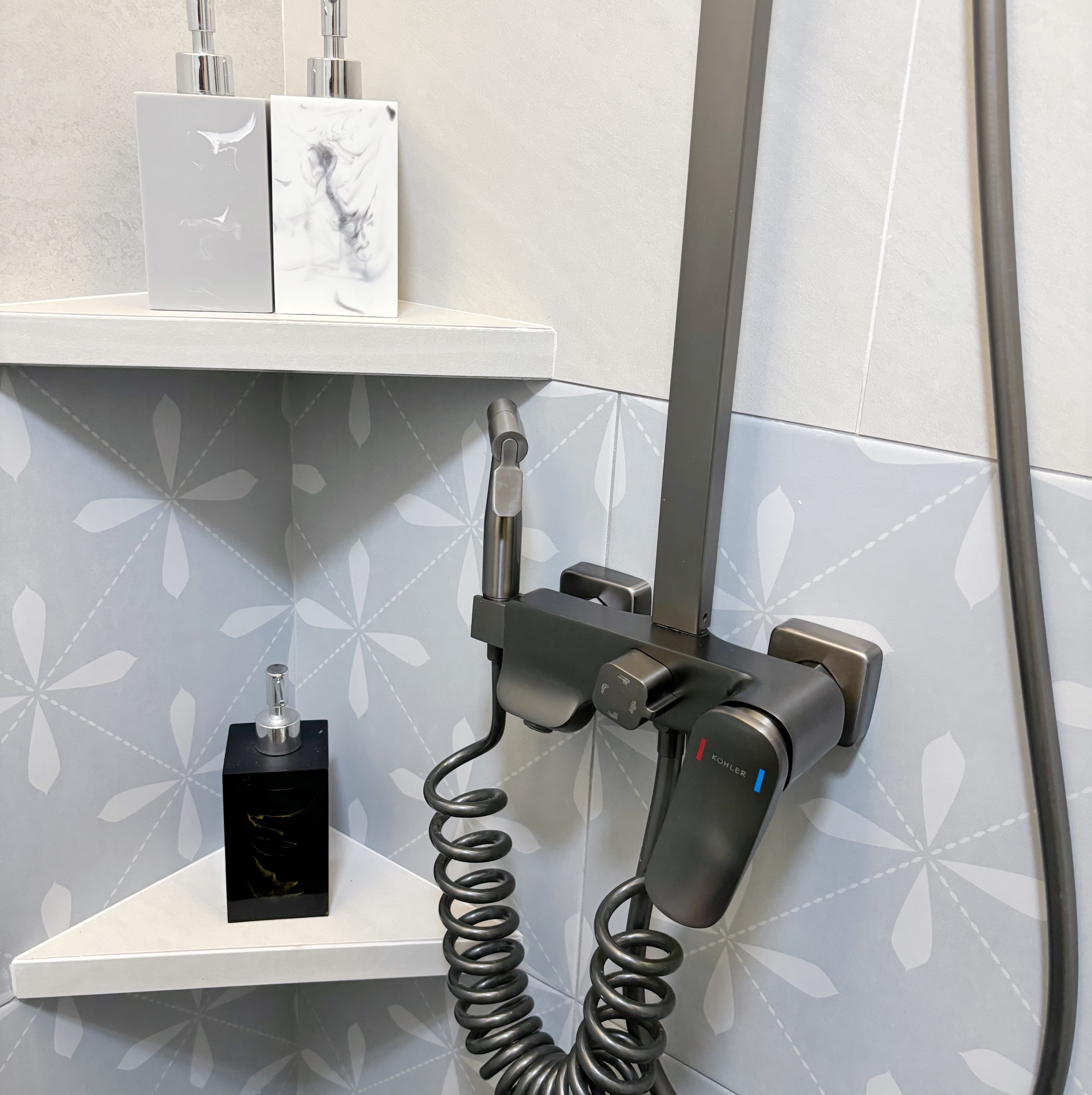 Our fun guest bath/powder room - Showerhead, modern faucet, sleek design, contemporary bathroom, minimalist decor, stylish