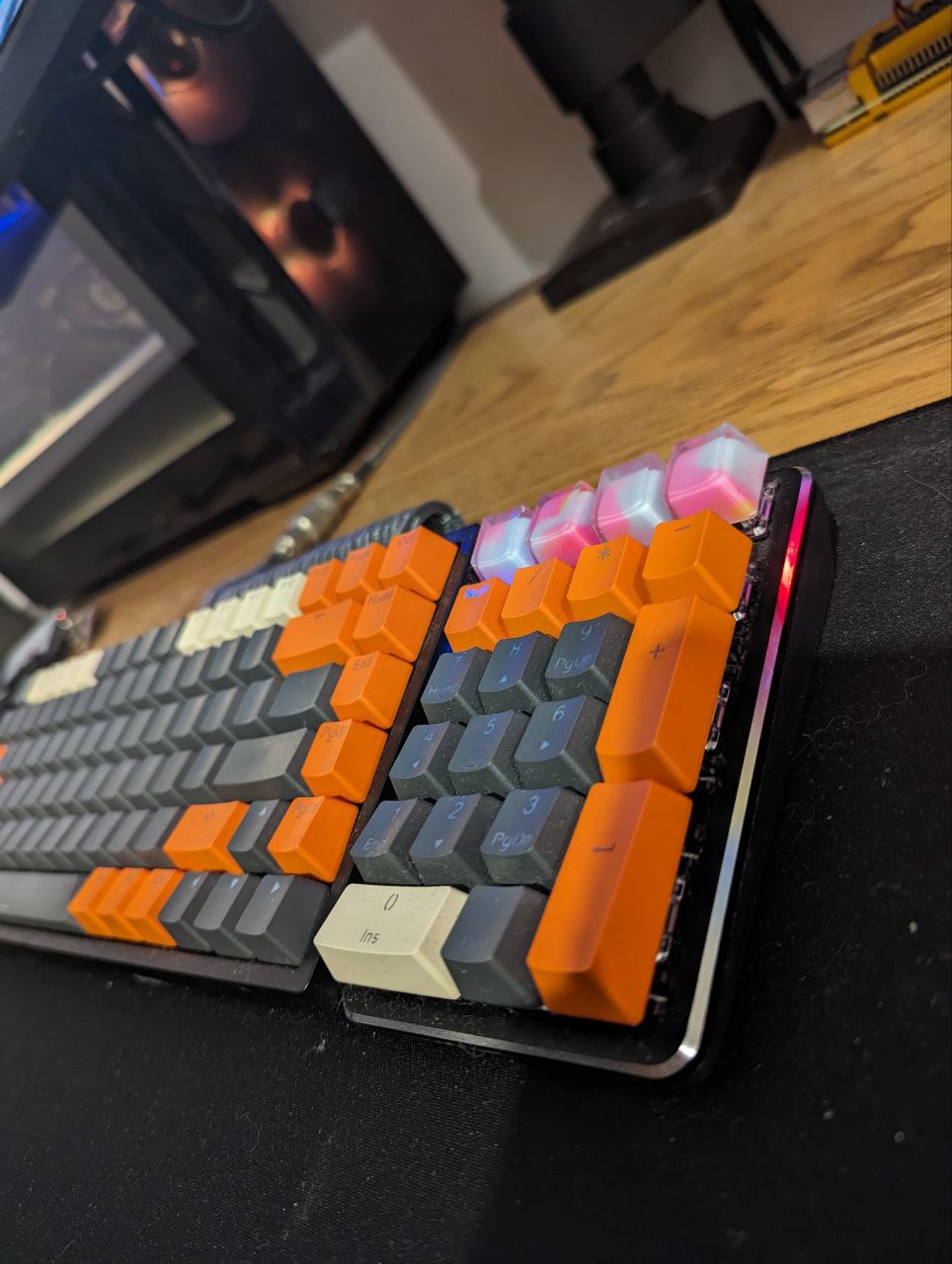 WFH and PFH (play from home) seamlessly - Vibrant RGB Keyboards on a Wooden Desk, Customizable Keys with Multiple Colors