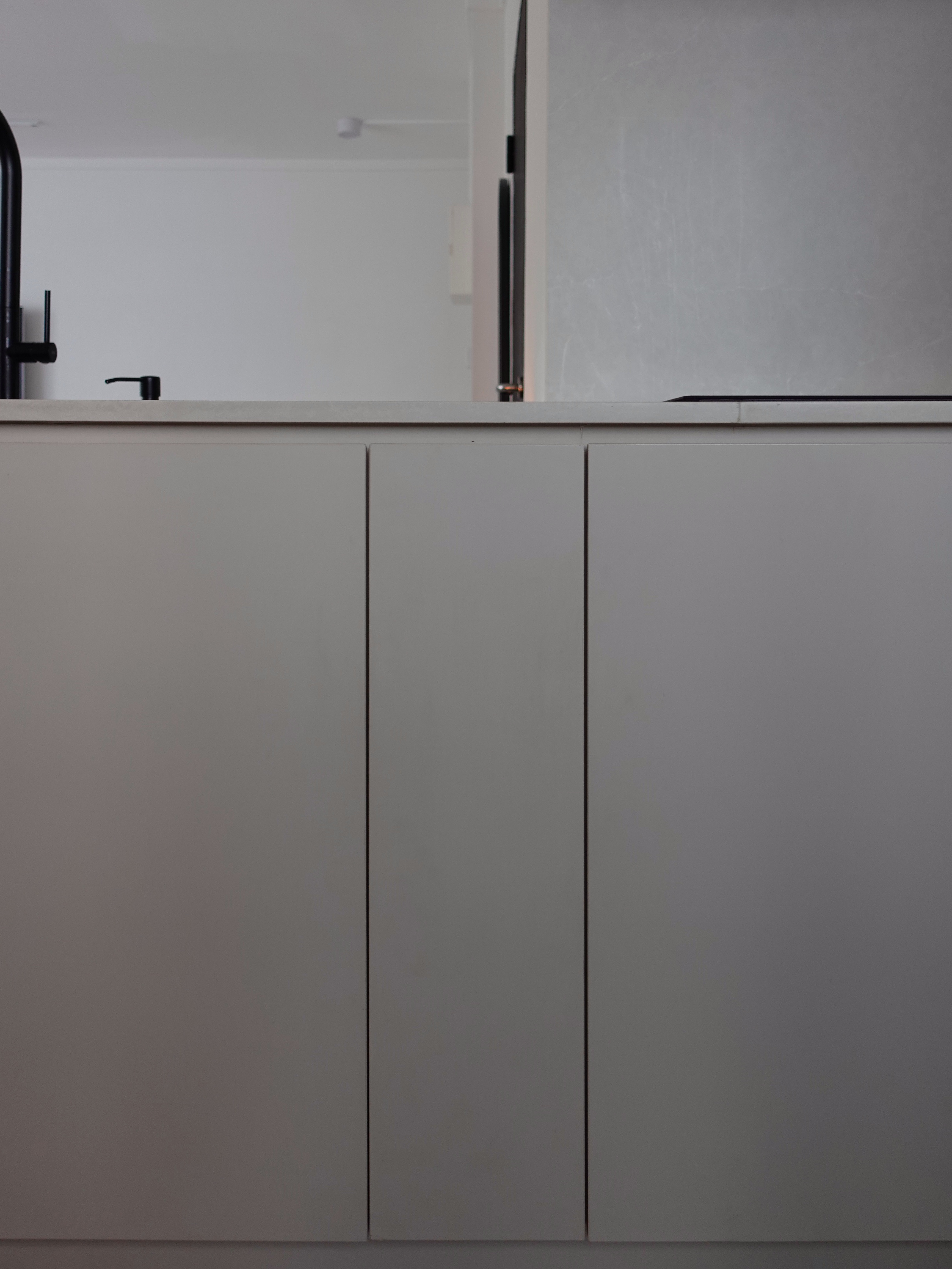 How we hid everything for a minimal kitchen - modern kitchen cabinetry, minimalist design, sleek countertop, stainless steel