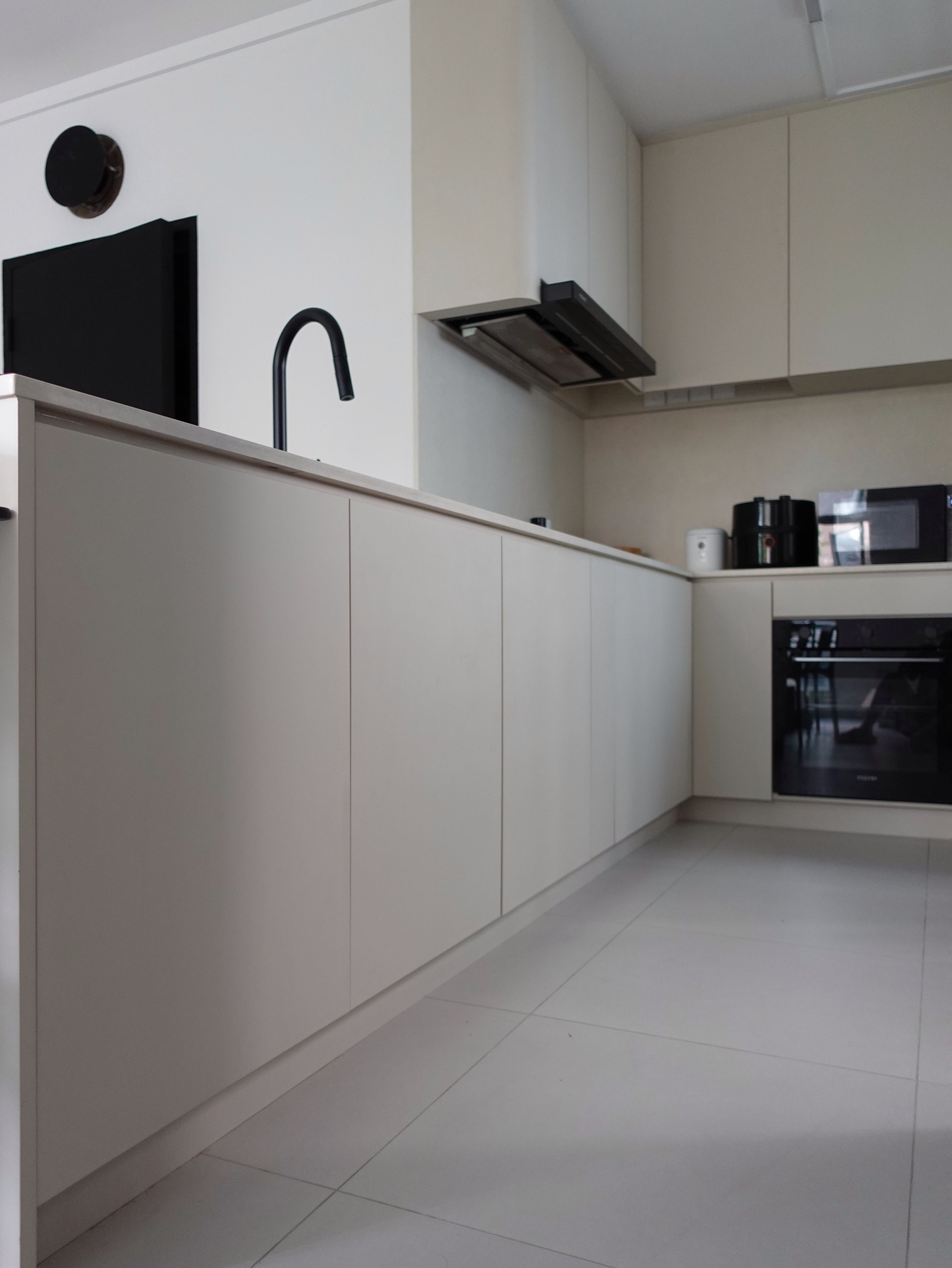 How we hid everything for a minimal kitchen - White kitchen cabinetry, modern design, minimalist style, sleek appliances