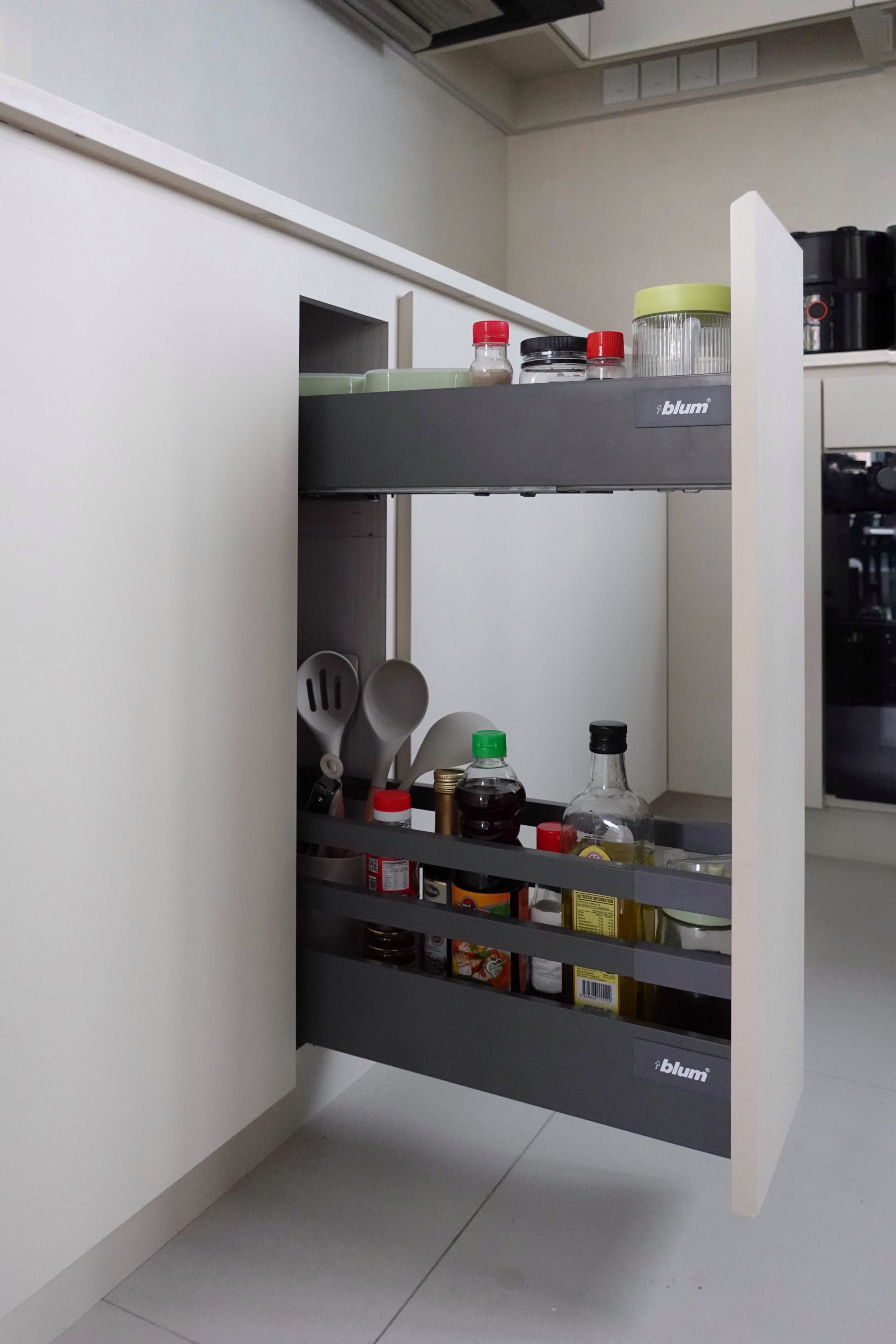 How we hid everything for a minimal kitchen - Kitchen cabinet with open shelves, various kitchen items, spice jars, utensils