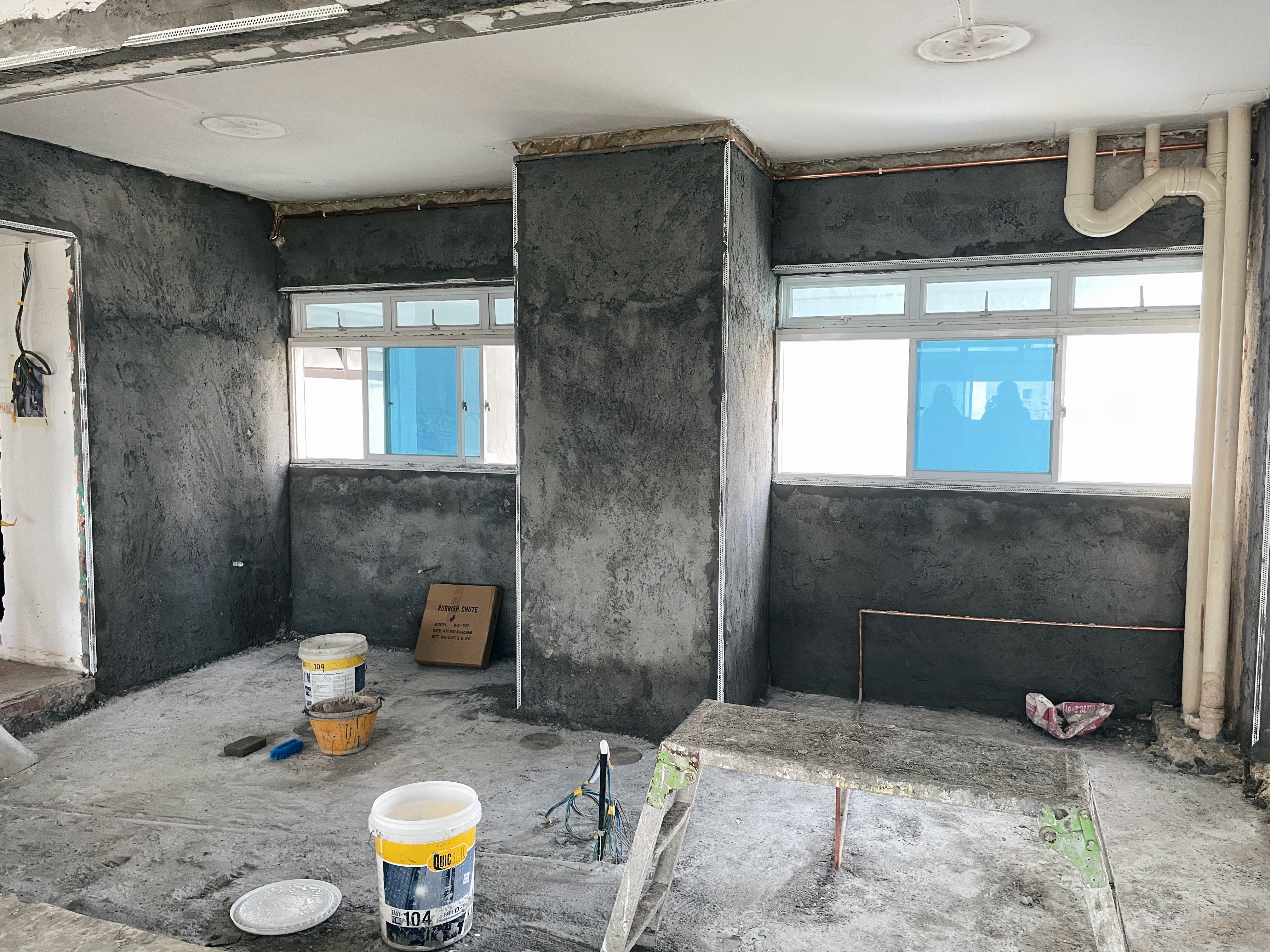 Spacious eclectic kitchen with large countertop!  - unfinished room, unfinished walls, exposed pipes, concrete floor