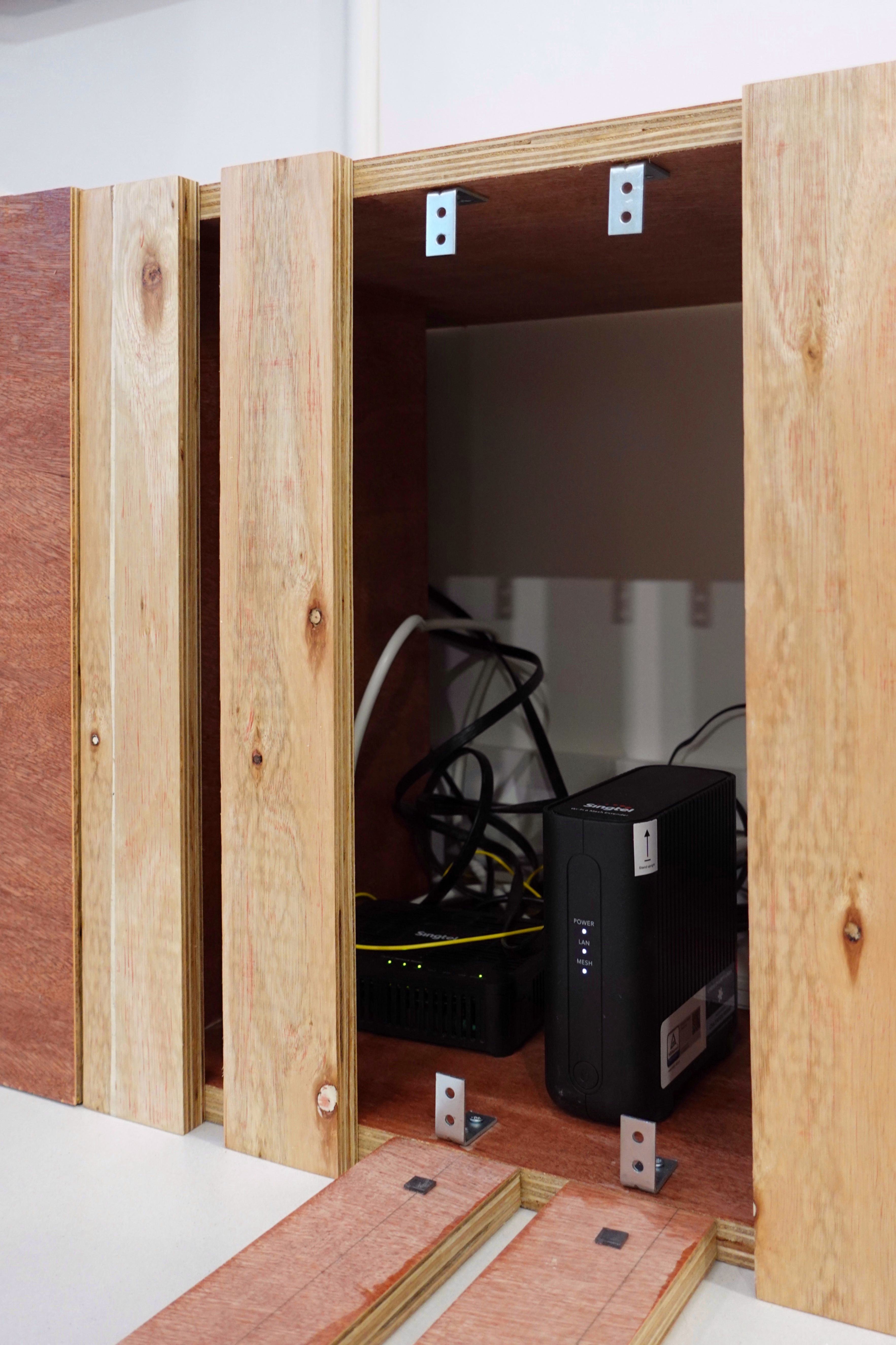 A minimal living room with a full out DIY TV console - Wooden frame, electrical box, power supply, cables, grounding