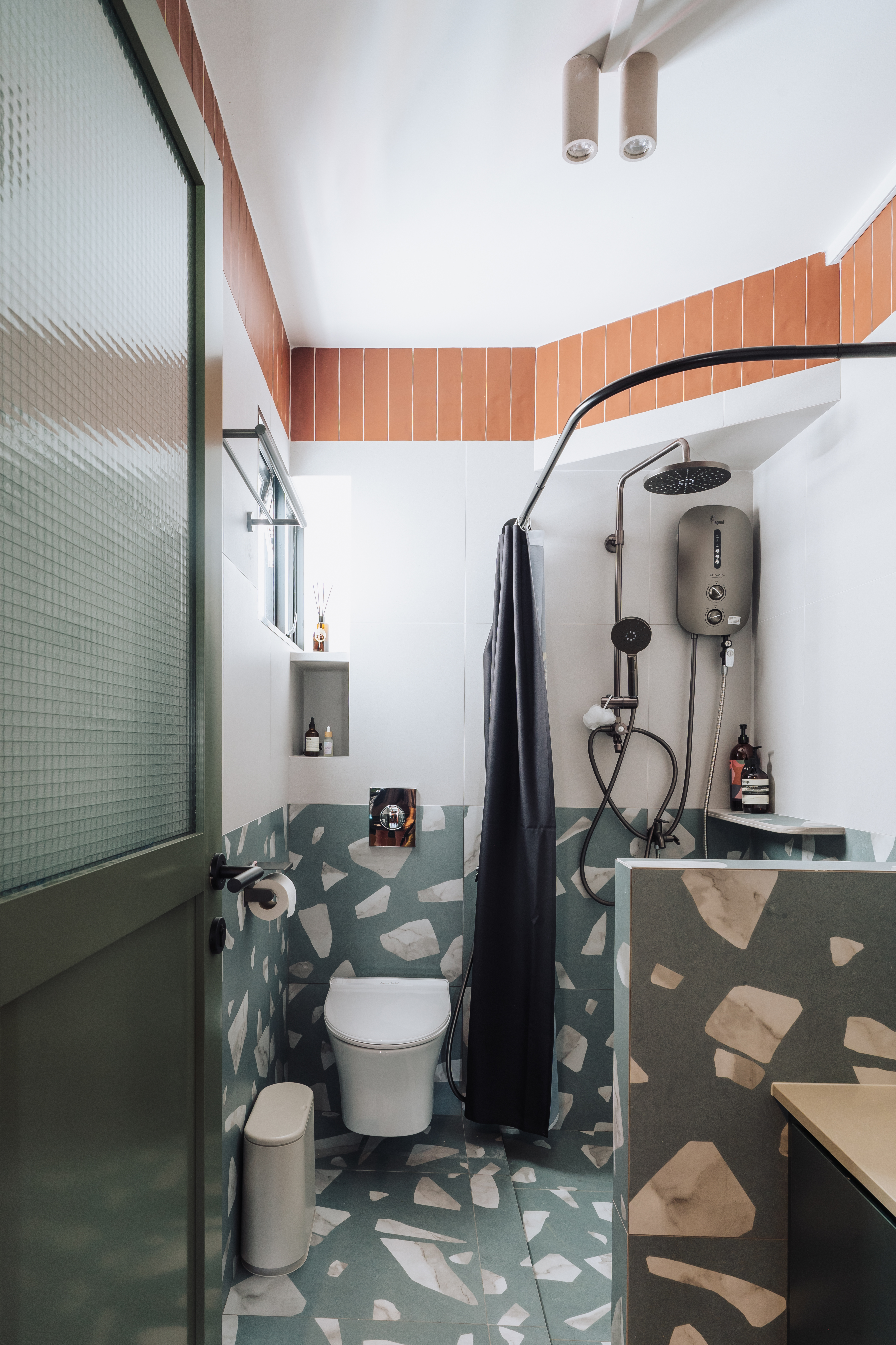 Wired glass - privacy with a fun touch for our toilets - Modern bathroom with green and white tiles, gray and white patterned