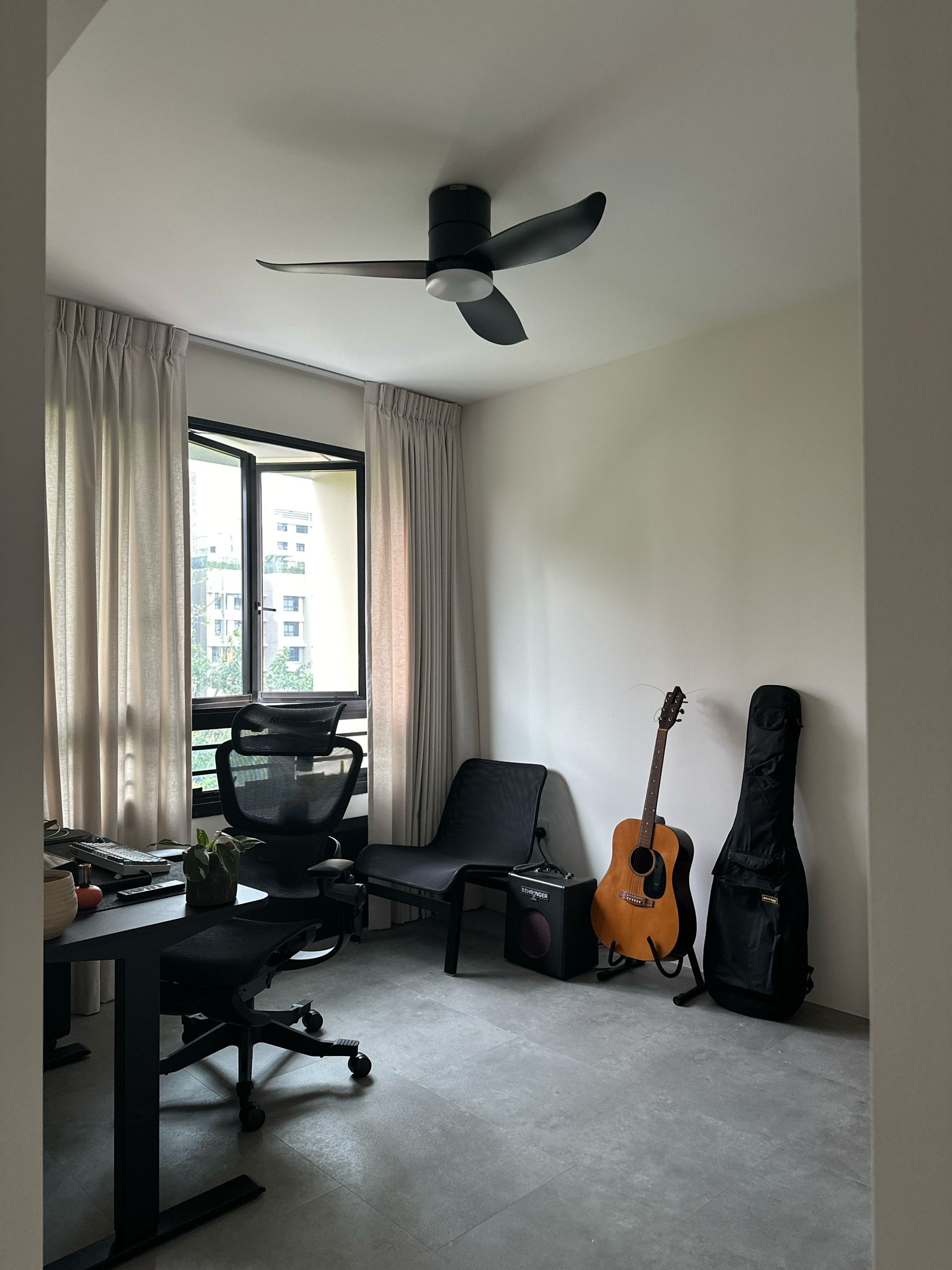 Work Hard Play Hard  - Modern minimalist home office, sleek black office chair, ergonomic desk, comfortable chair, natural