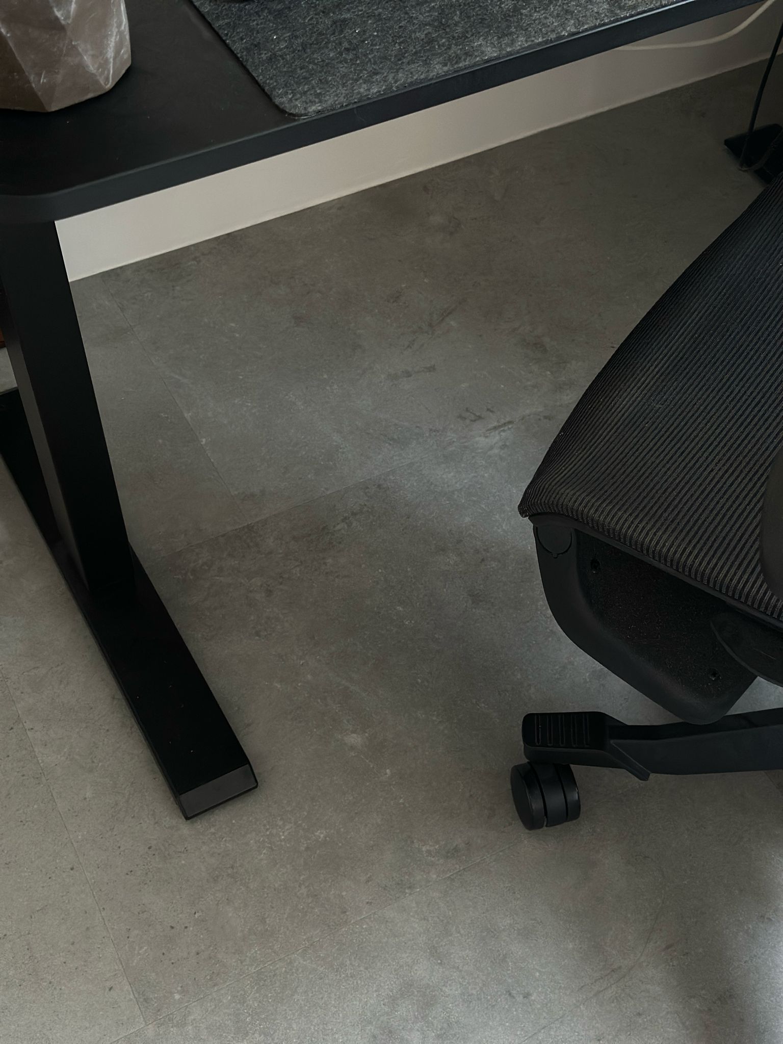 Work Hard Play Hard  - Modern workspace, ergonomic chair, black office chair, textured upholstery, minimalist design, sleek