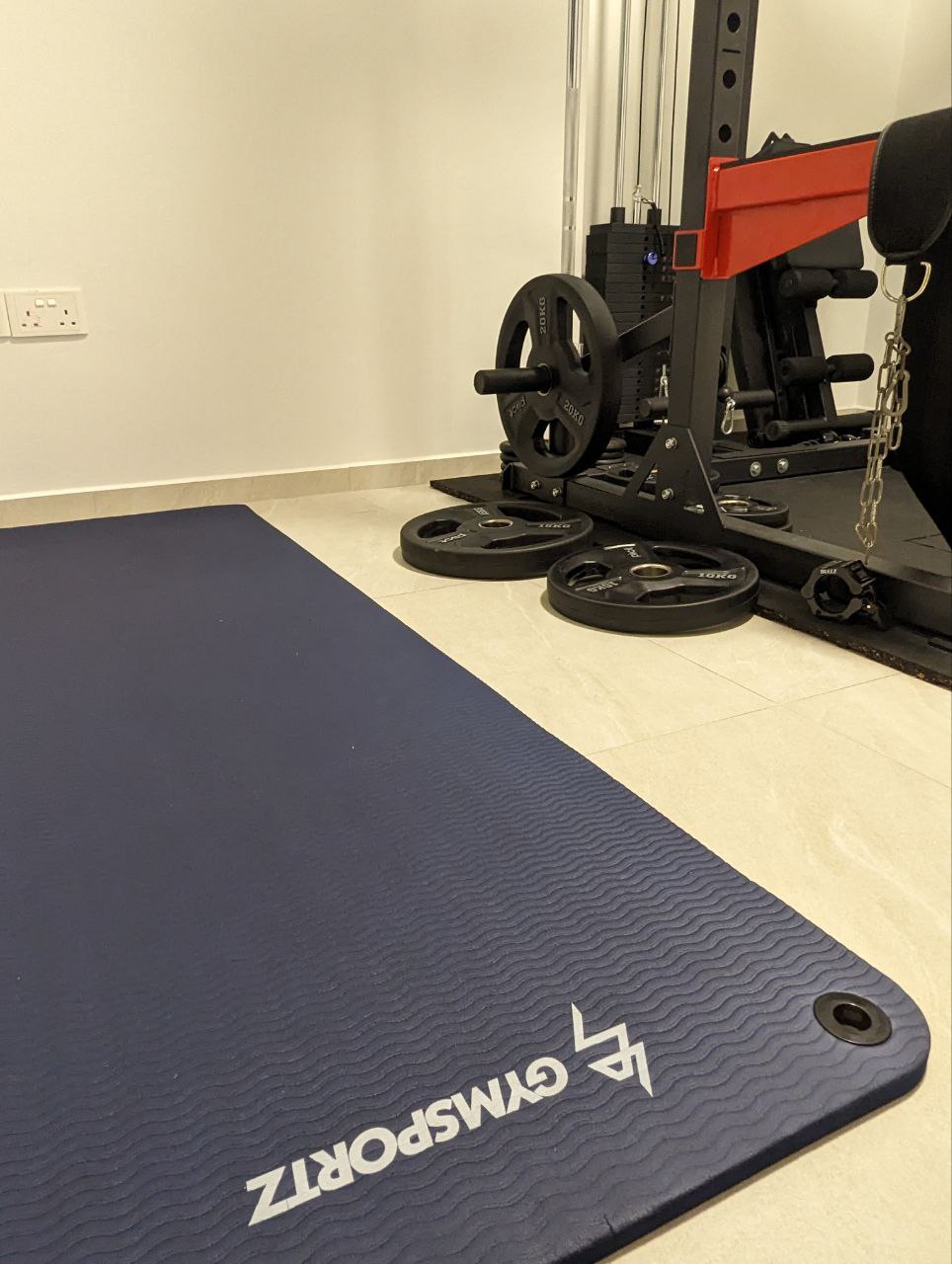 Magic of a home gym - Weightlifting station, exercise equipment, barbell, weight plates, black and red setup, exercise