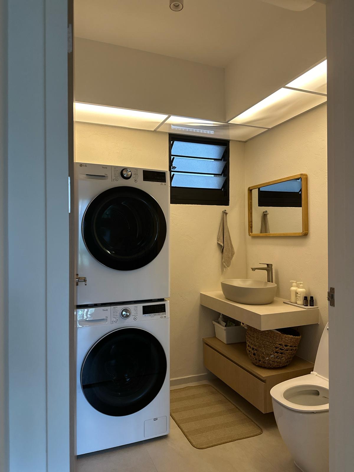 Texture wall in a powder room  - Lavished, modern, compact, dual washer dryer unit, sleek design, minimalist, integrated