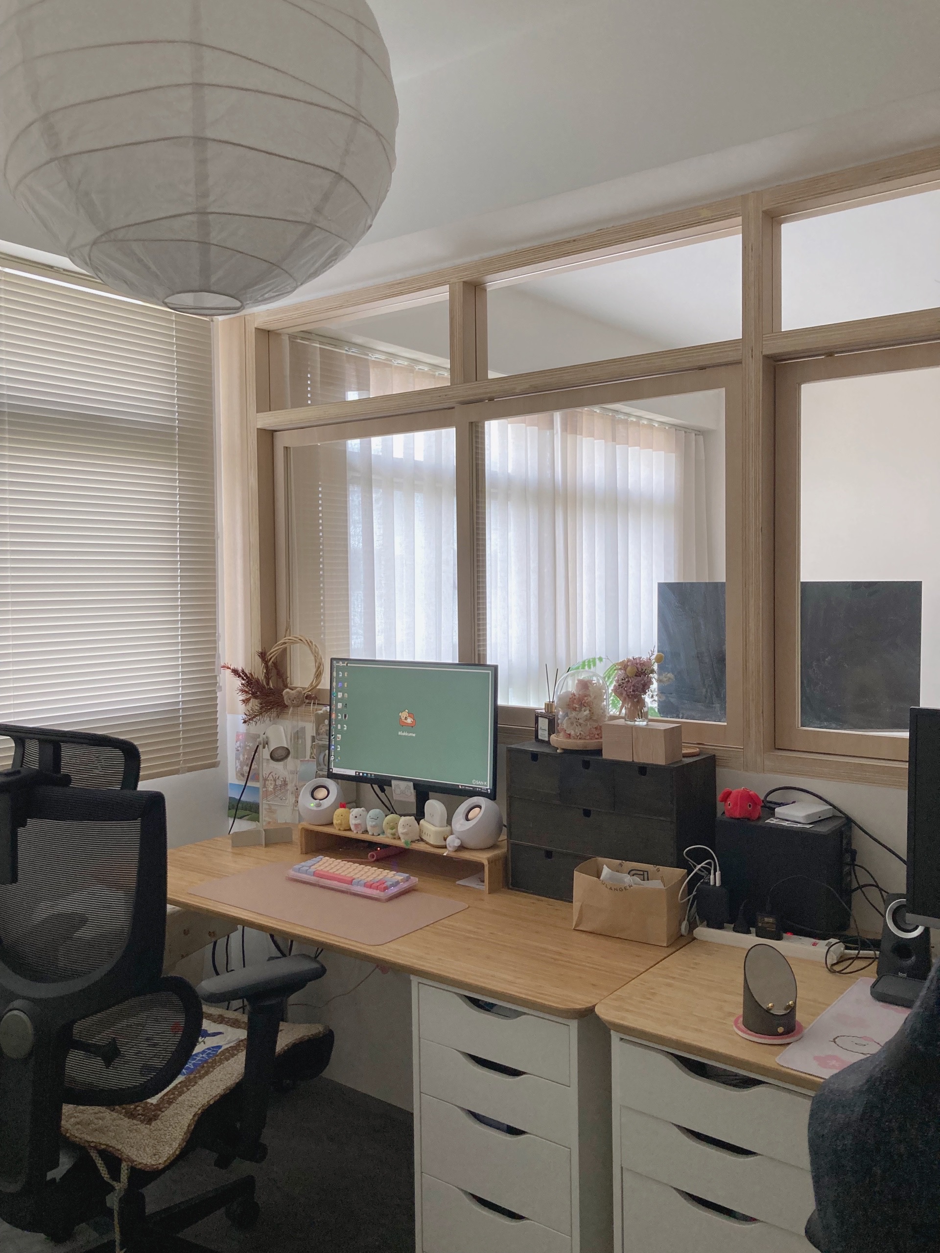 Bright and Open Minimalist Workspace - Wooden desk, computer monitor, white blinds, window with sheer curtains, black office
