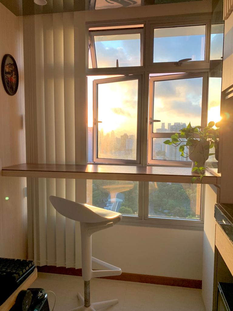 Our Second Home Renovation | on what we have saved - Sunset view from high-rise window, cityscape in the background, natural