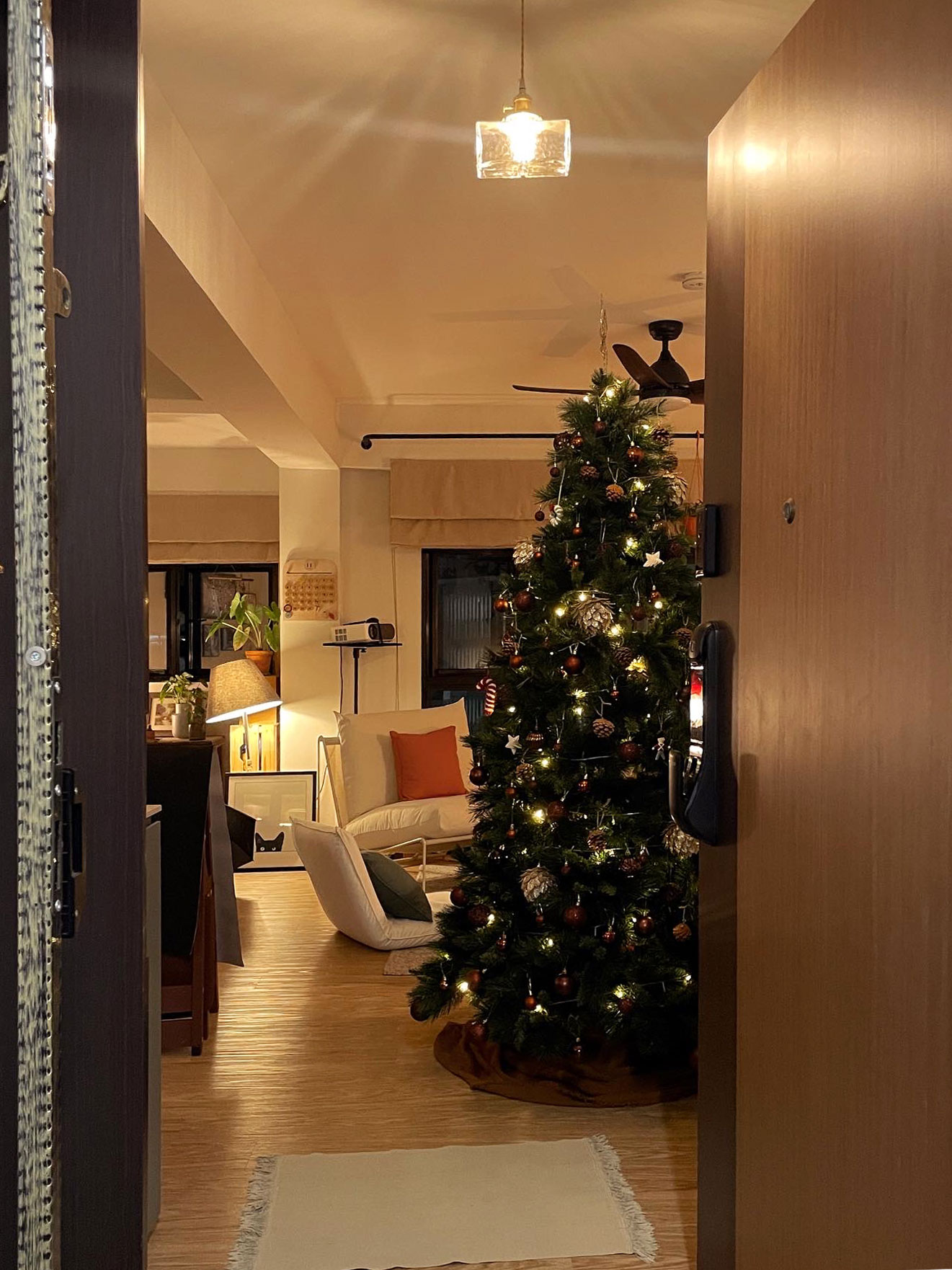 Keep prying eyes 👀 away: Maintaining privacy in your foyer - Warmly lit living room, cozy ambiance, festive decorations