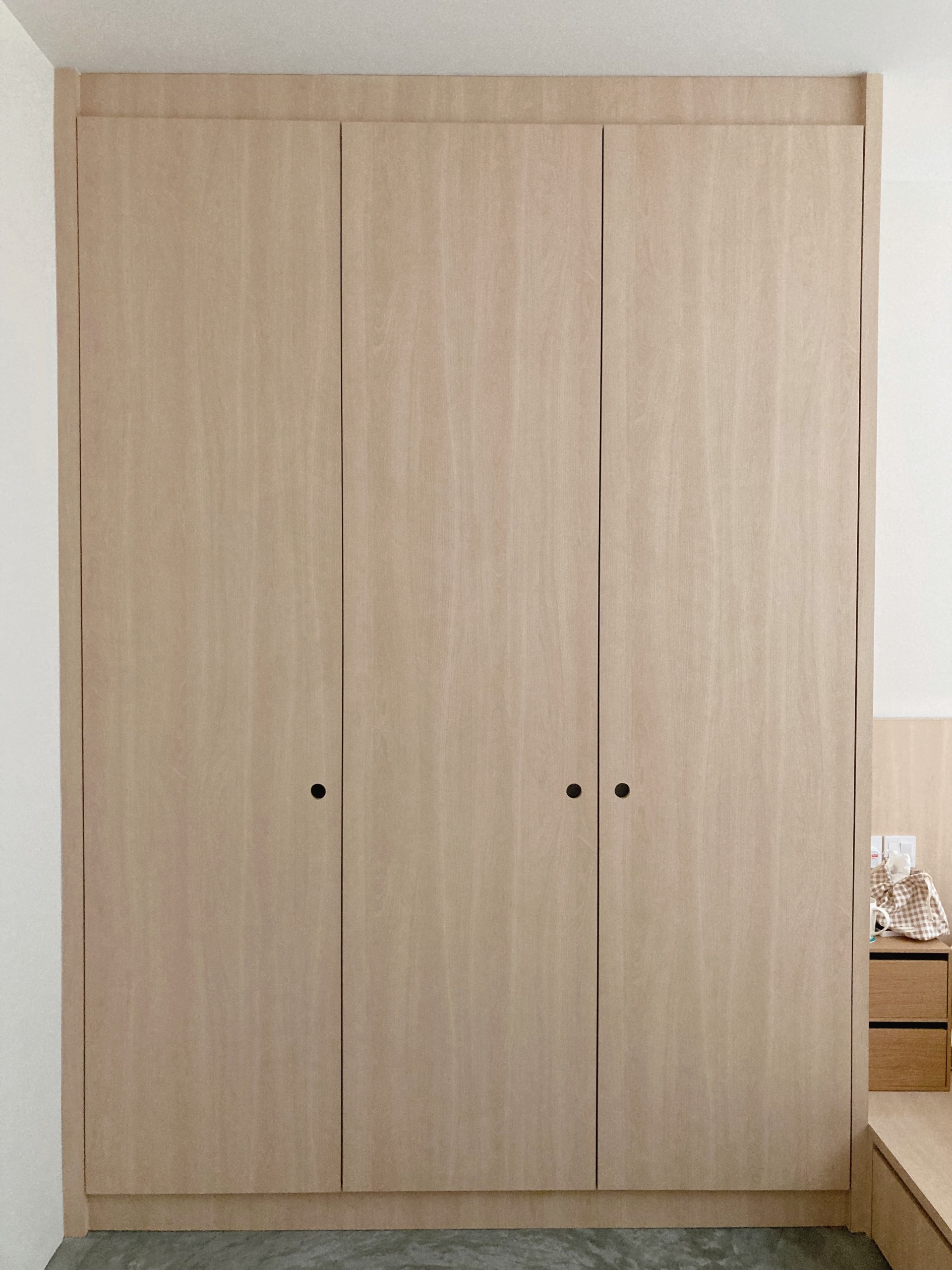Choosing the right carpentry design and details  - Wooden wardrobe with two doors, light beige finish, minimalist design