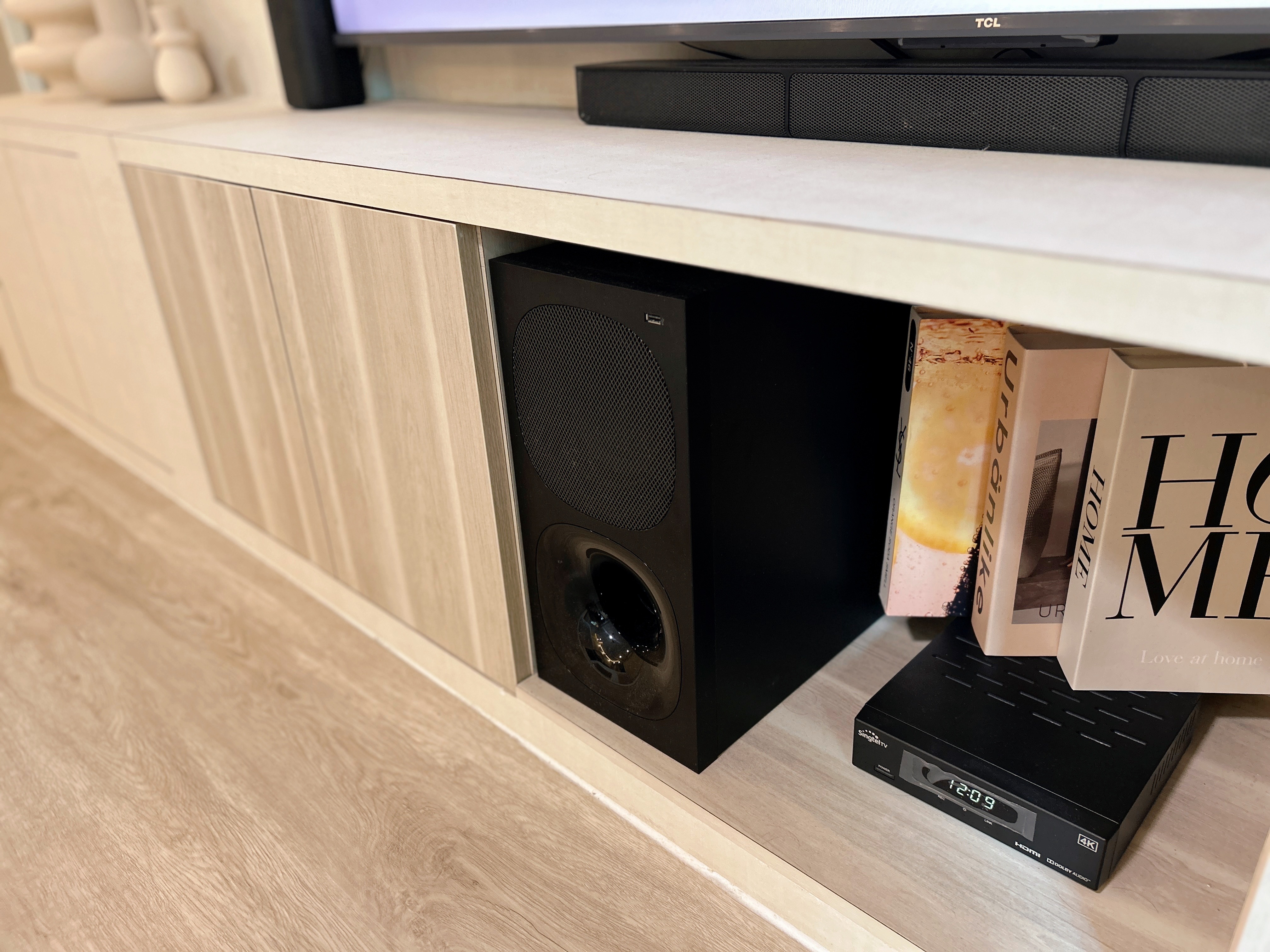 Living Room: Chill and Netflix! - Modern entertainment center, sleek TV stand, minimalist design, wooden floor, black