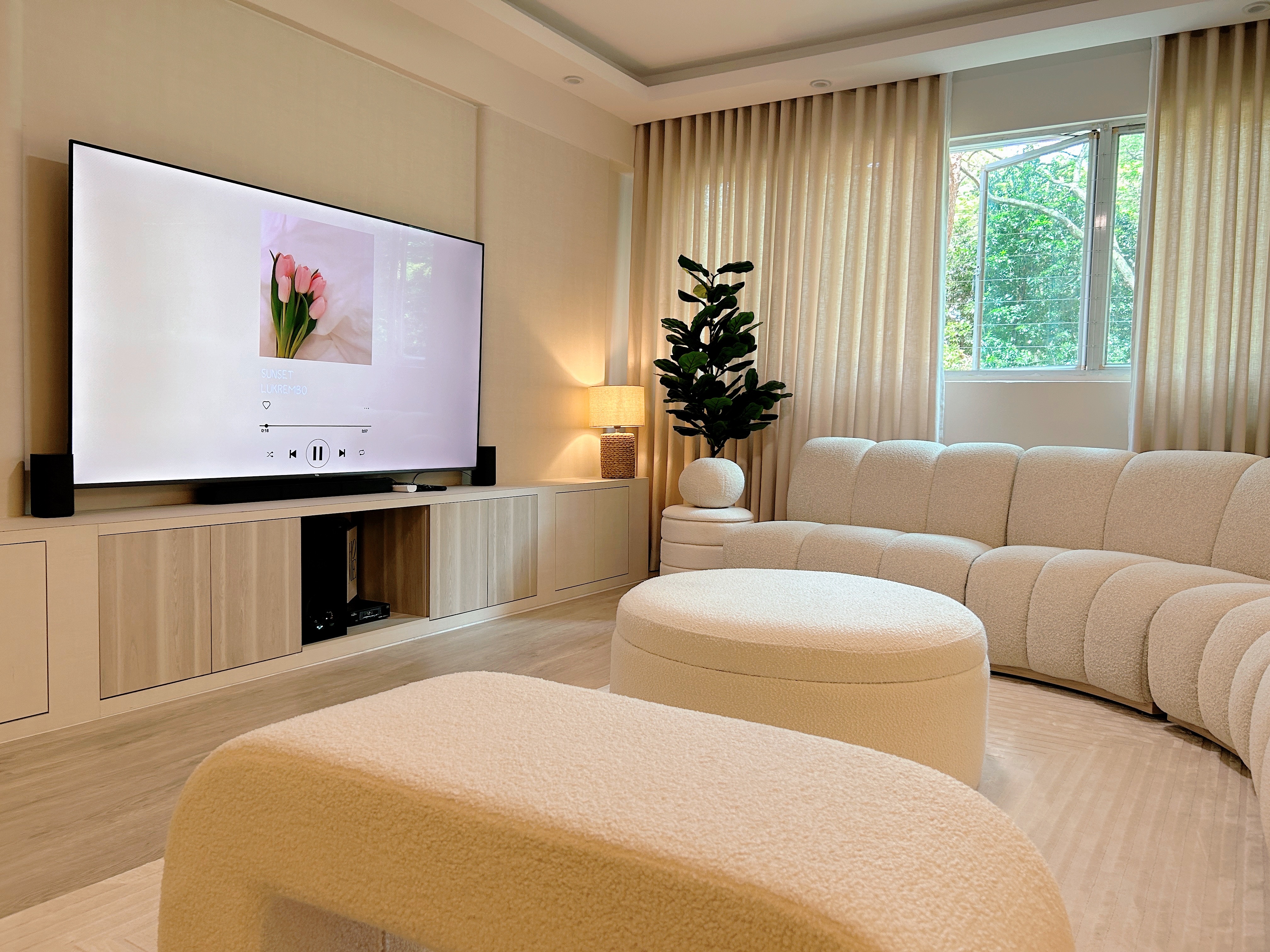 Living Room: Chill and Netflix! - Modern living room, cozy seating, beige sofa, soft lighting, large flat-screen TV, elegant
