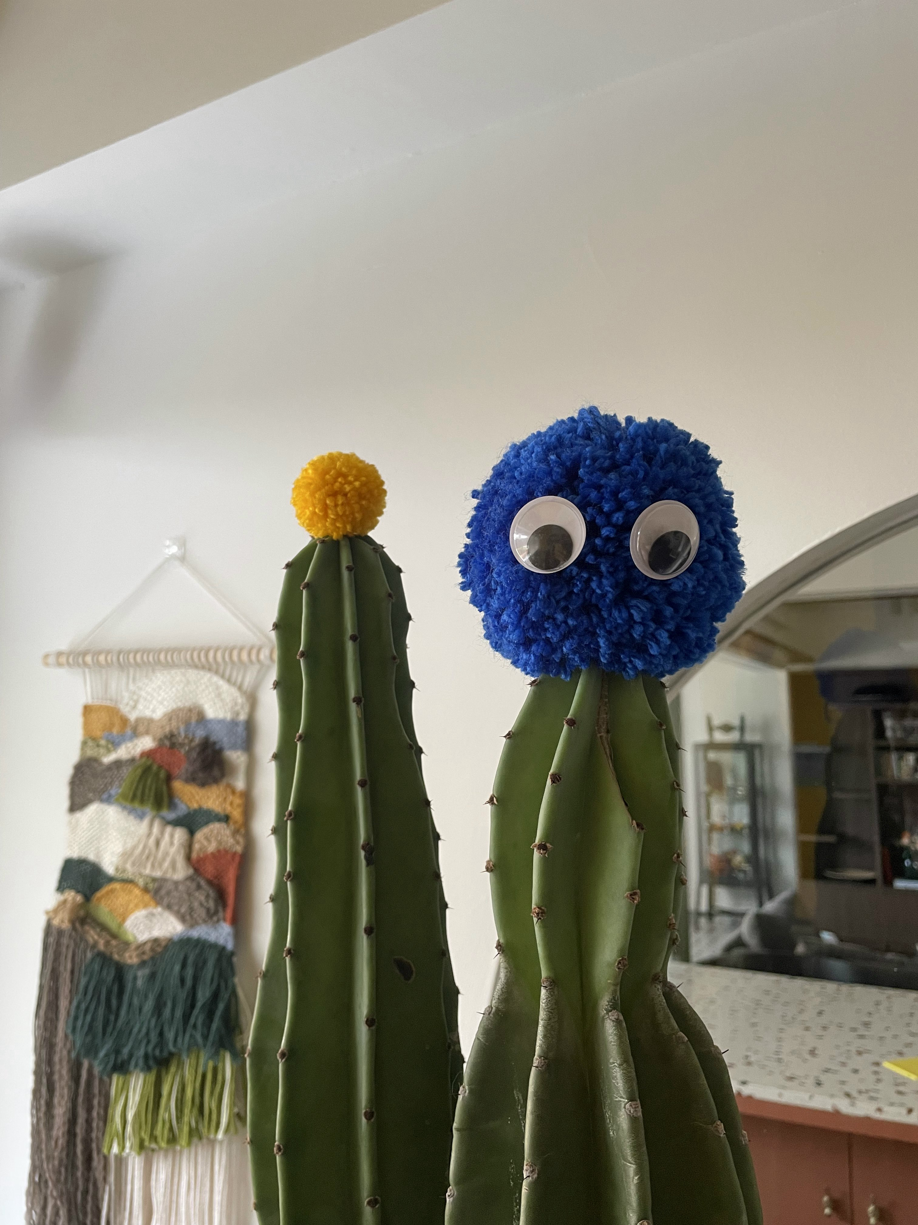Studio - A bright pop of yellow and a whole lot of knick-knacks!  - Cactus, fuzzy, googly eyes, blue and yellow, playful