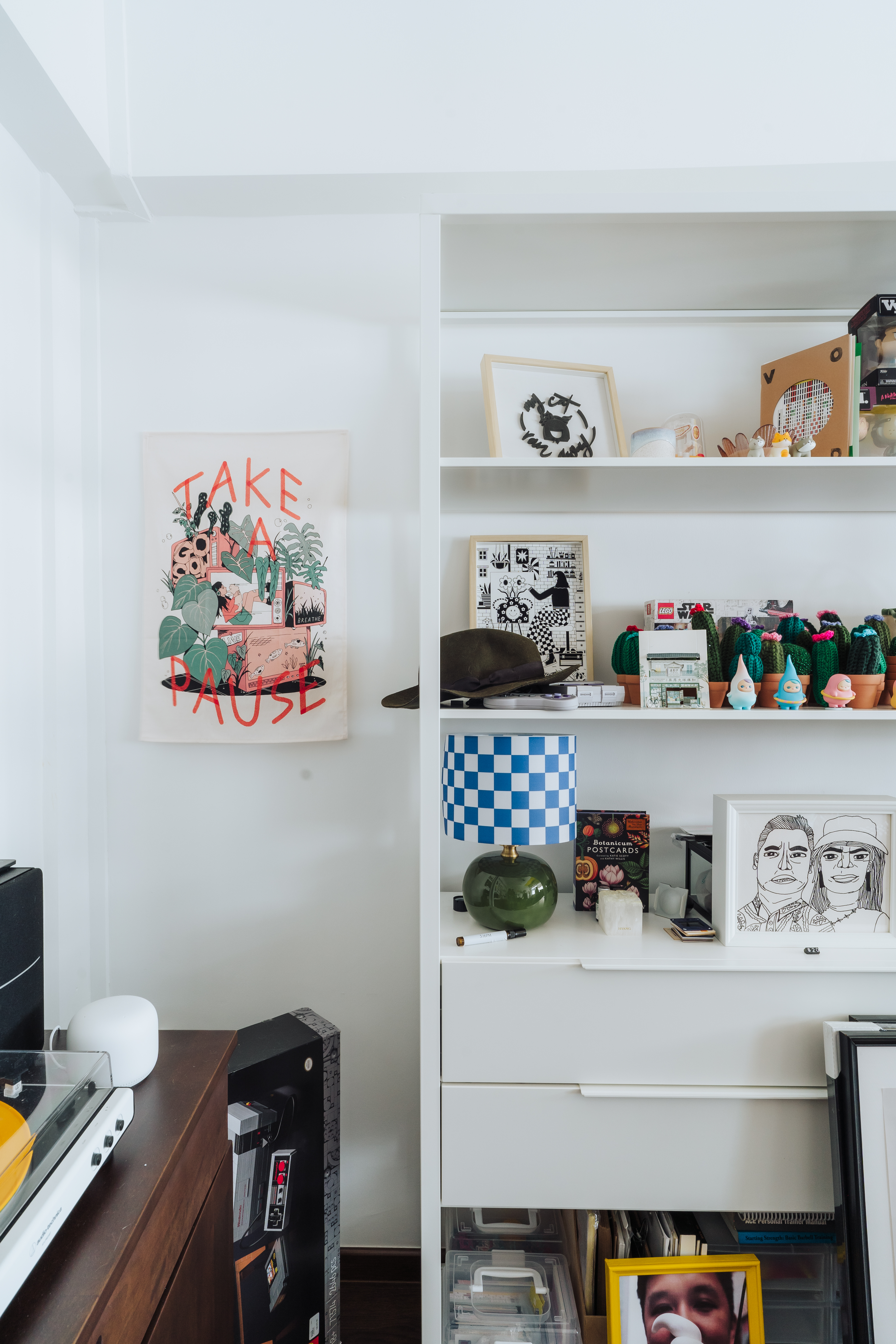 Studio - A bright pop of yellow and a whole lot of knick-knacks!  - Wall art, shelf, black and white illustration, tropical