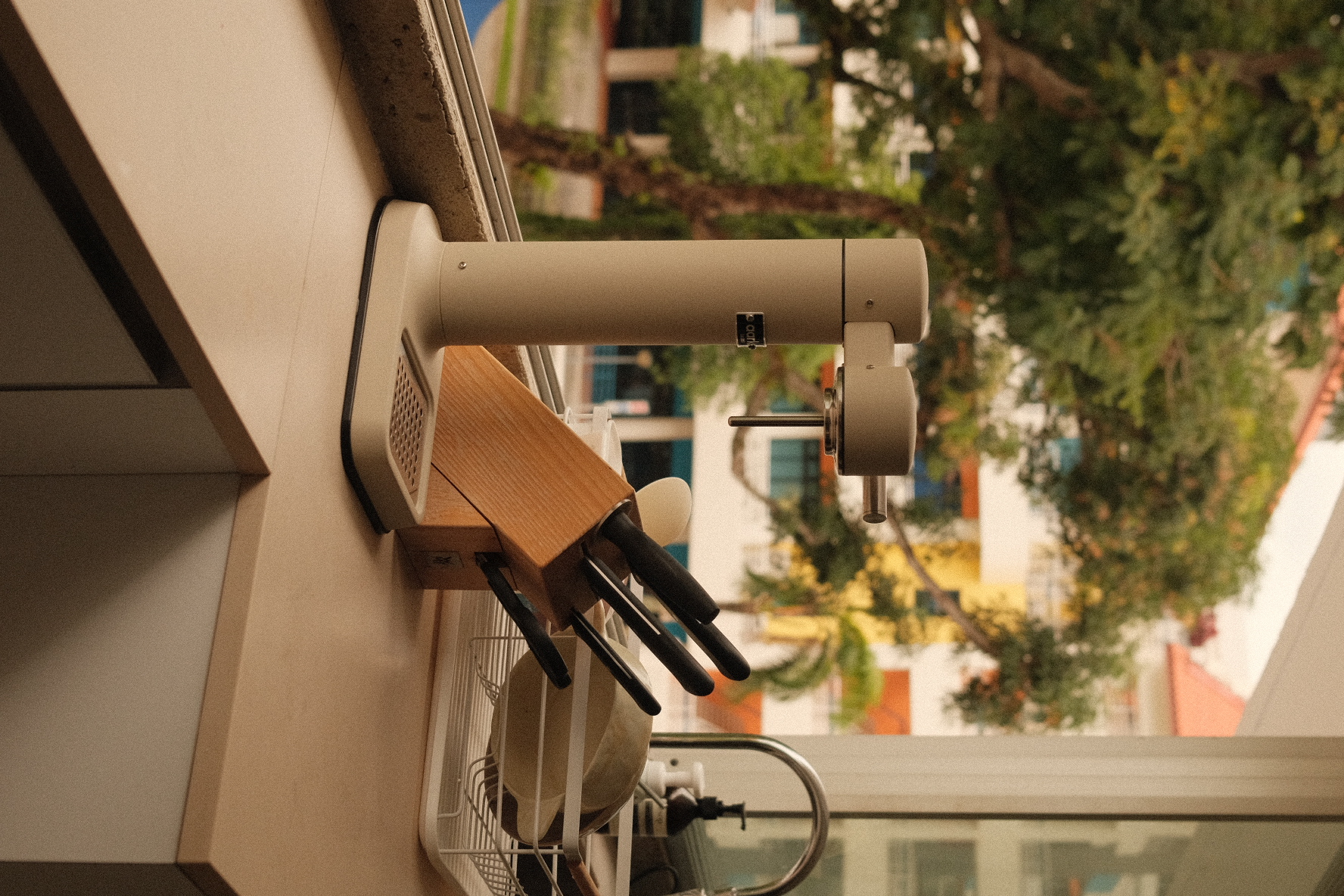Open kitchen overlooking a green oasis! - kitchen countertop, knife rack, kitchen utensils, dish rack, kitchen cabinet