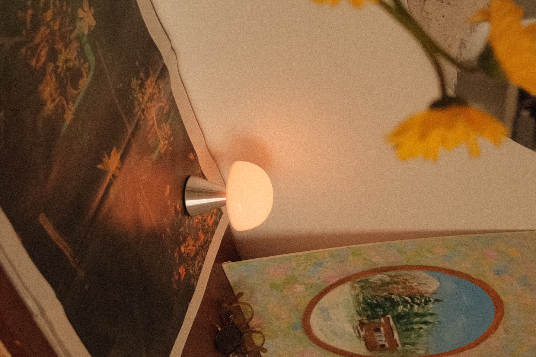 The tiny entryway to our heritage home - wall art, lamp, yellow flowers, vintage painting, abstract design, nature theme
