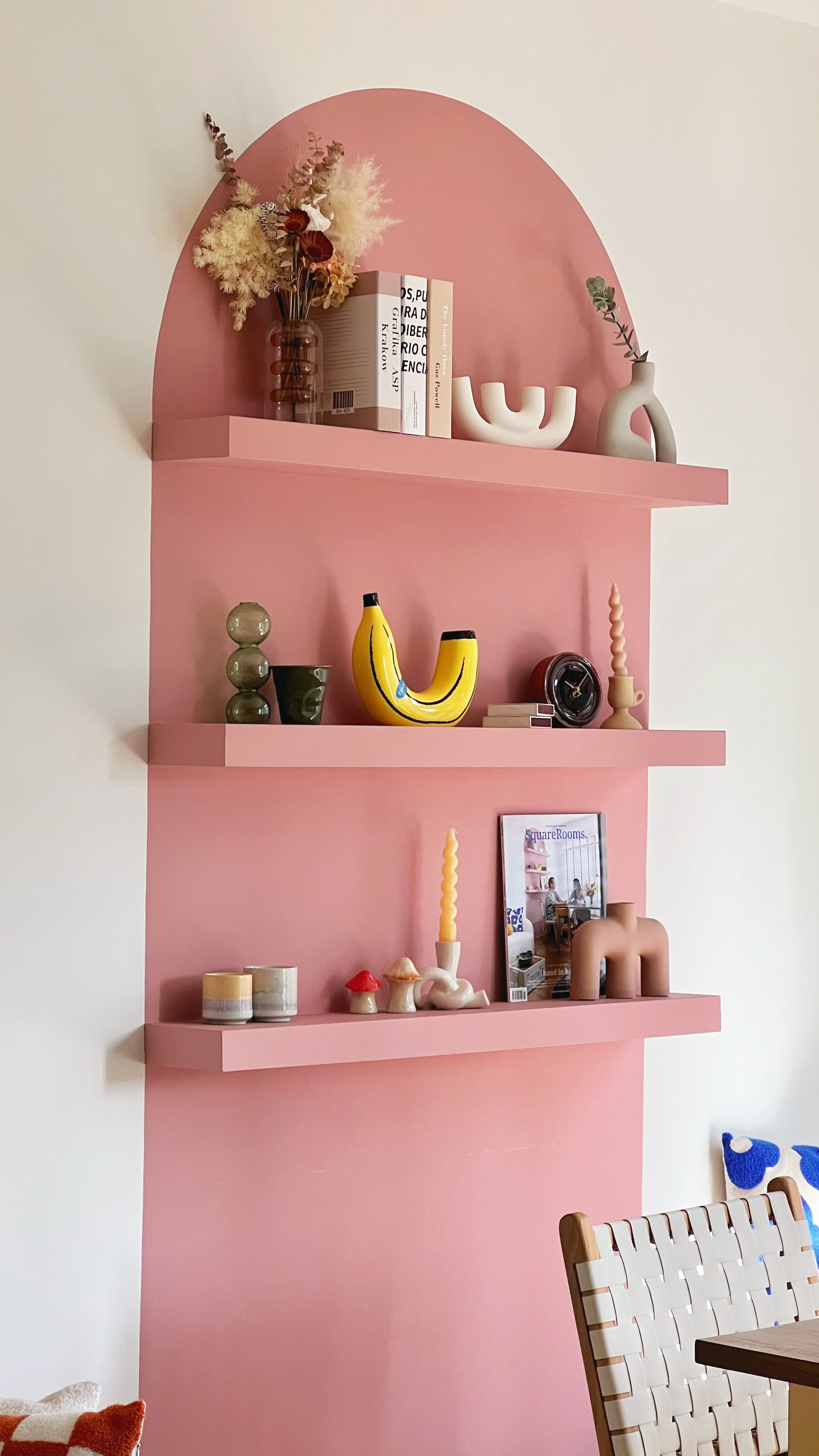 The coziest part of our home. - Pink wall, modern shelf, decorative items, abstract art, minimalist decor, colorful vases