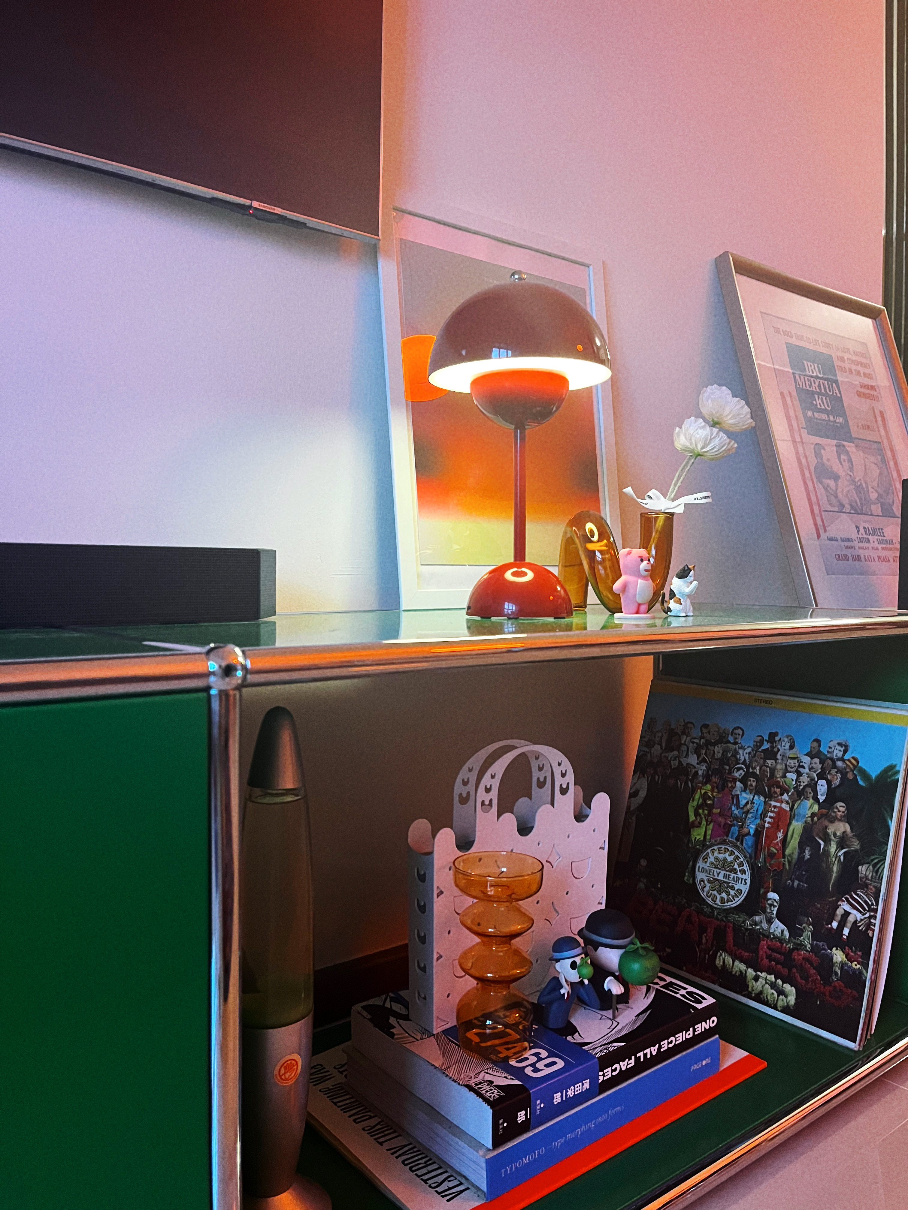 A retro and playful home - modern decor, colorful lamp, framed picture, abstract art, whimsical figurines, vintage radio