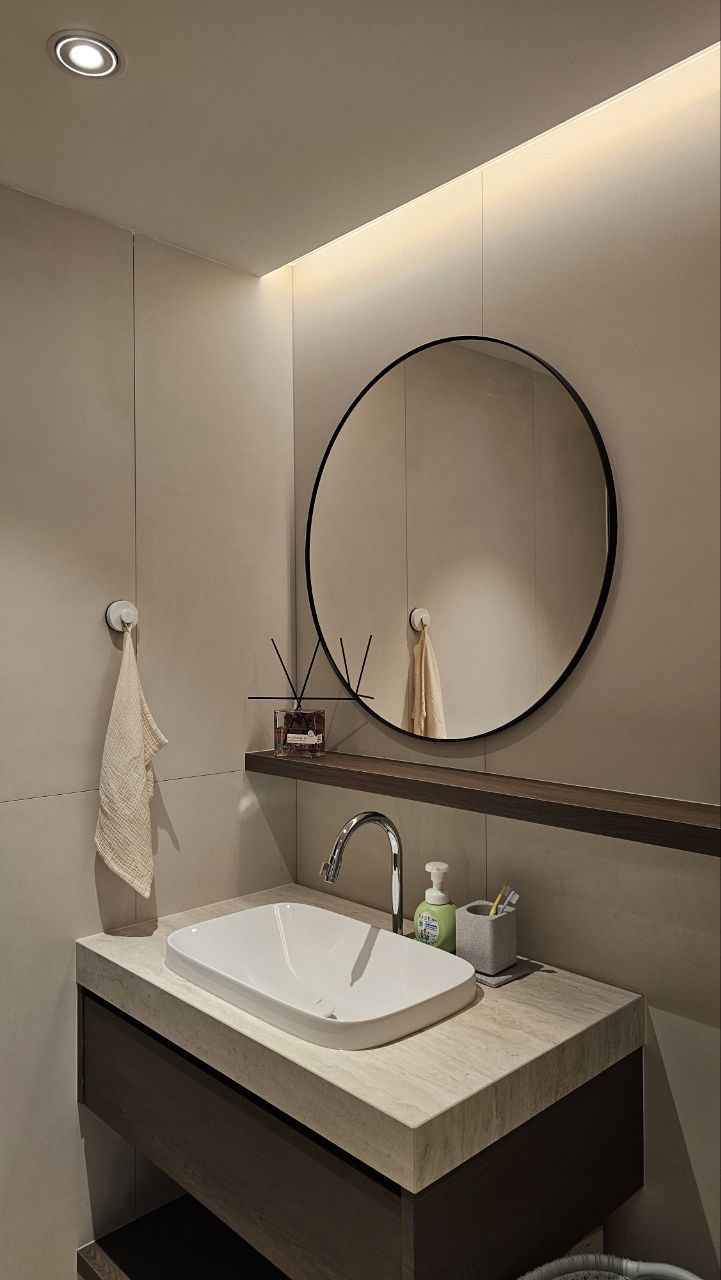 A modern minimalist inspired home  - Modern minimalist bathroom, sleek vanity, round mirror, floating shelf, beige tiles