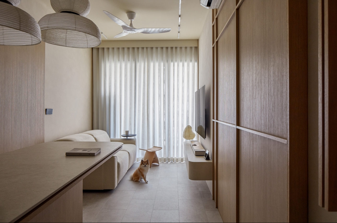 A 689sqft 2-Bedder Japandi Resale in North-east - Modern minimalist living room with beige walls, large window with sheer
