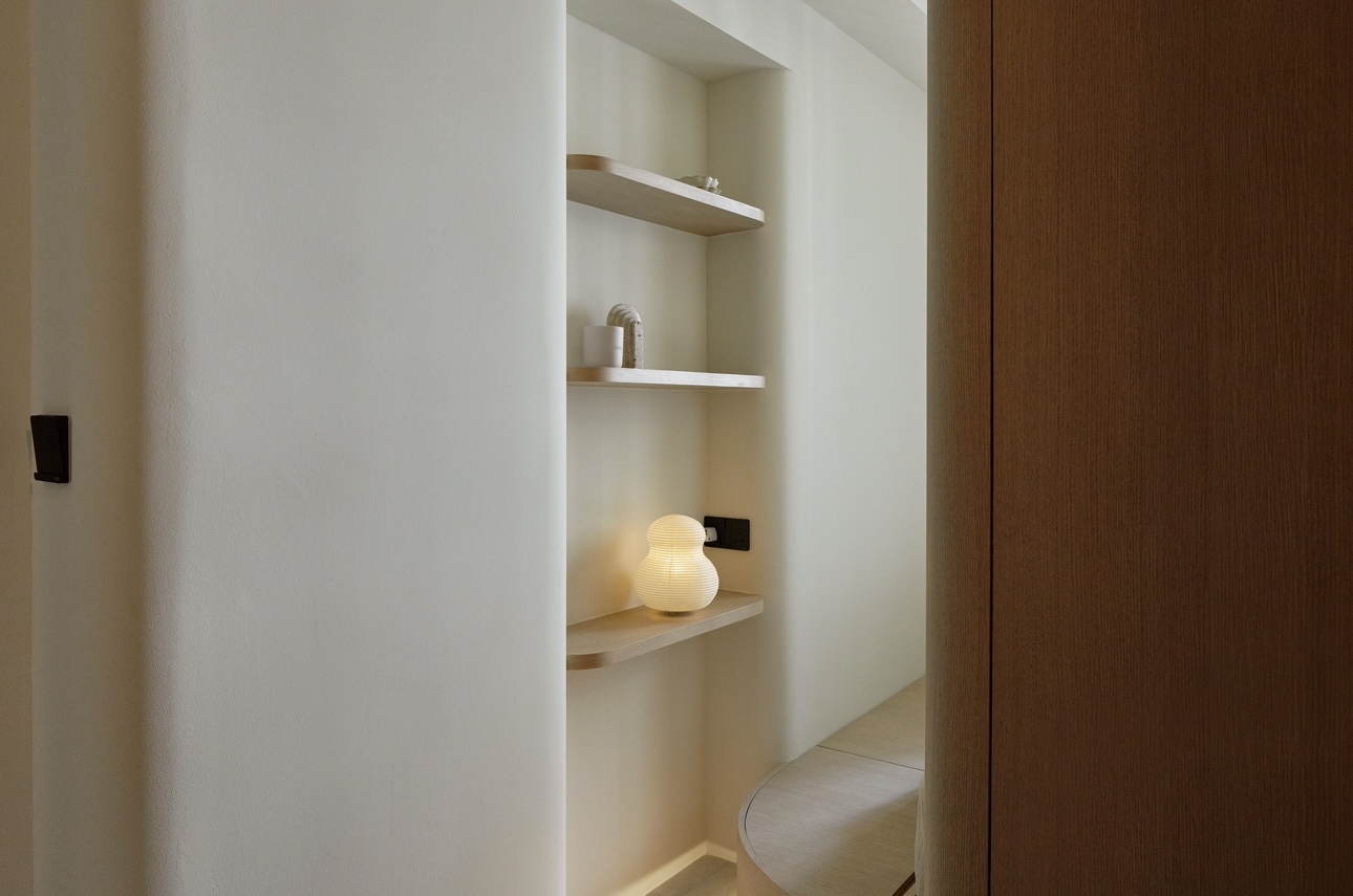 A 689sqft 2-Bedder Japandi Resale in North-east - Shelf with minimalist decor, soft ambient lighting, light wooden shelf