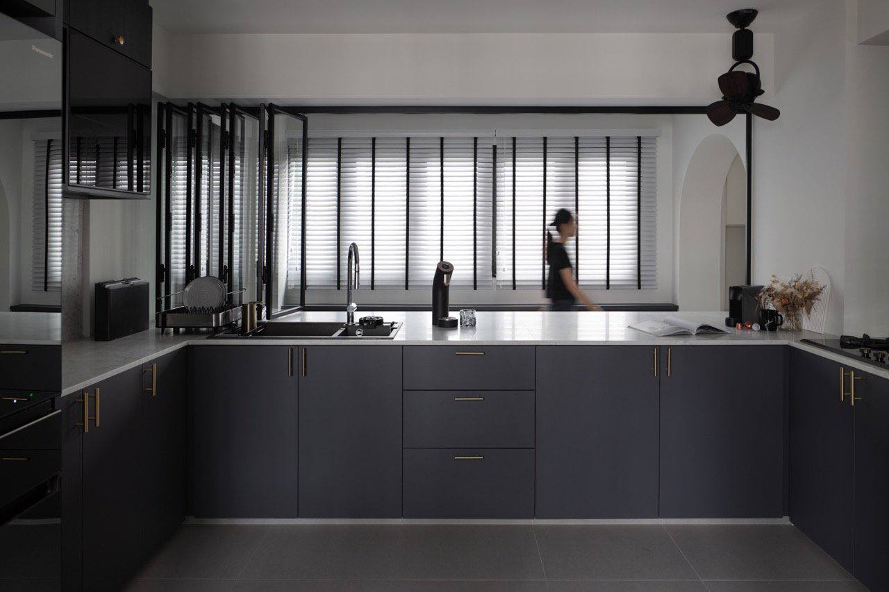 Modern x Contemporary Open-Concept Home Unveiled! - Dark gray kitchen cabinetry, modern appliances, sleek countertops, black