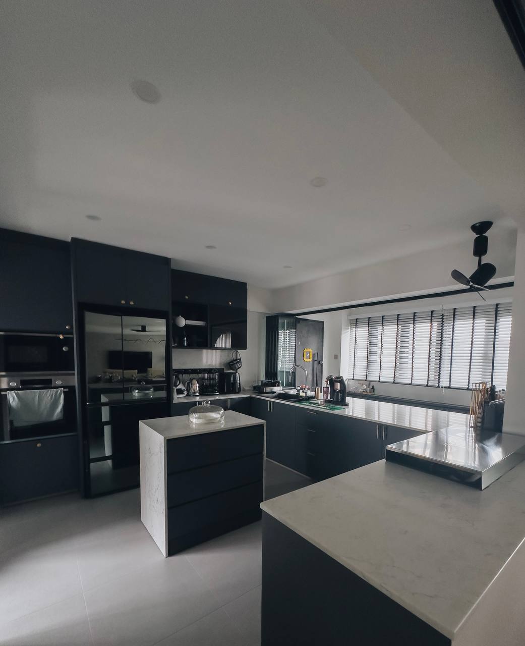 Modern x Contemporary Open-Concept Home Unveiled! - Modern kitchen with sleek black cabinetry, stainless steel appliances