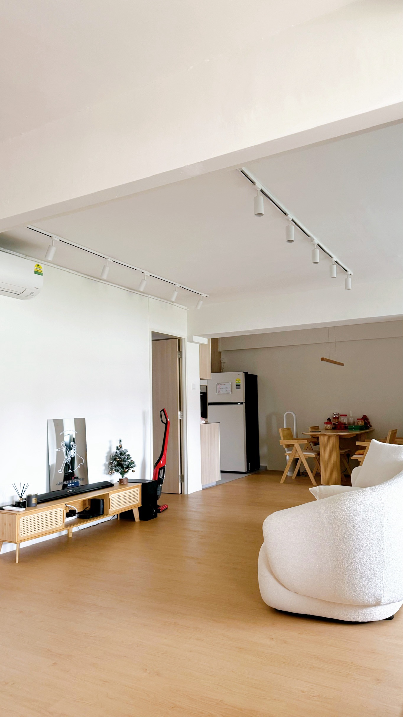 Welcome to The Tofu House! - Modern minimalist living room, sleek entertainment center, white wall with minimalist art