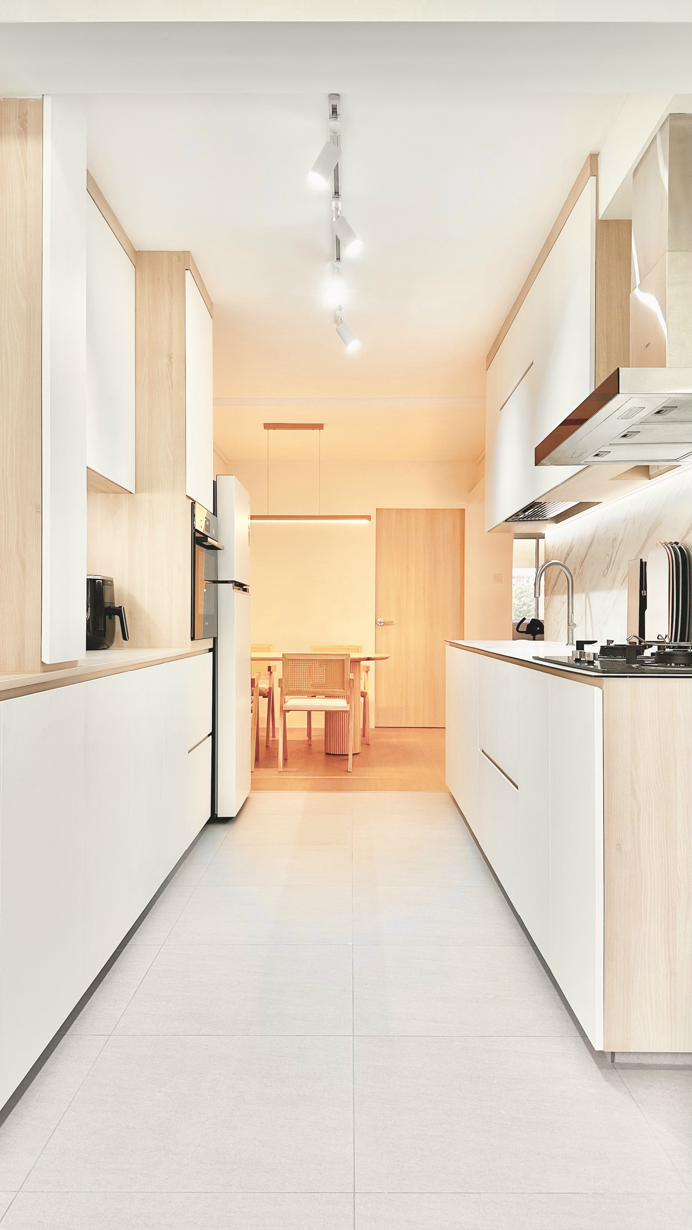 Welcome to The Tofu House! - Modern kitchen with sleek white cabinets and wooden accents, stainless steel appliances