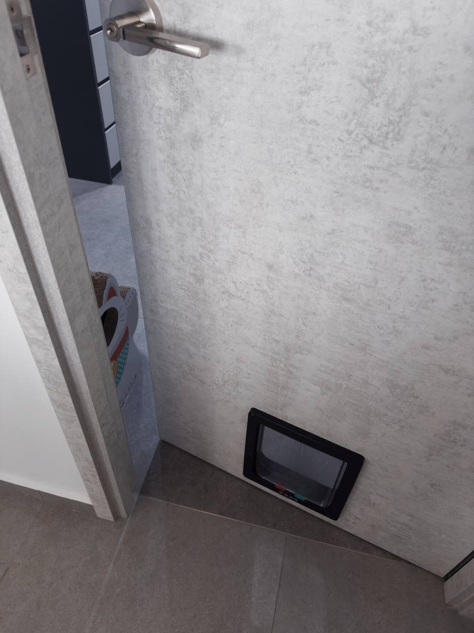 Modern x Contemporary Open-Concept Home Unveiled! - Floor-standing pet bed, modern bathroom, tiled floor, gray textured wall