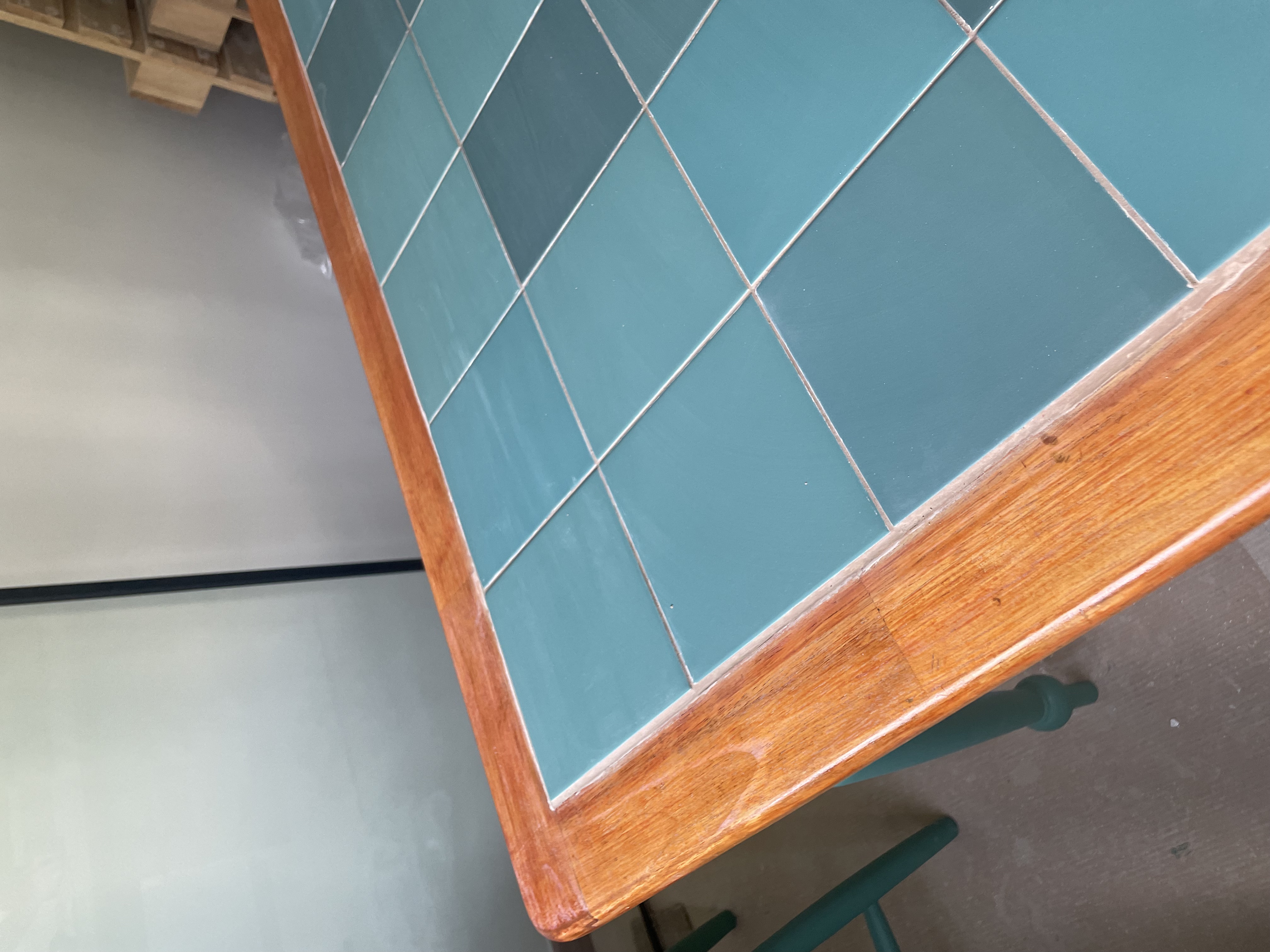 Meet our most "talked about" piece of furniture 👀 - Teal-tiled table with wooden frame, rustic design, weathered finish