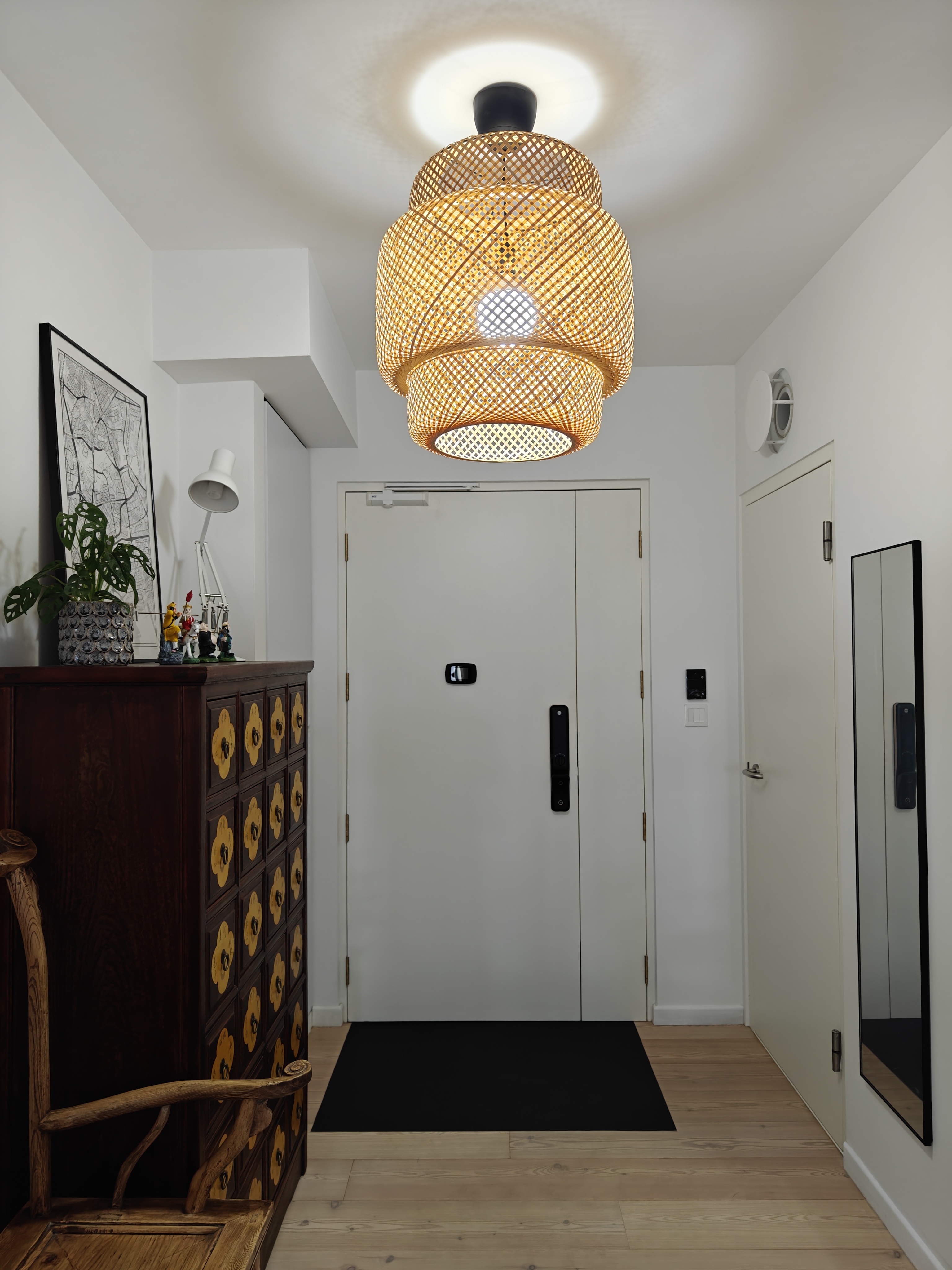 A 3-Gen Scandinavian Home - Modern minimalist interior, white walls, wooden dresser, decorative plants, abstract painting