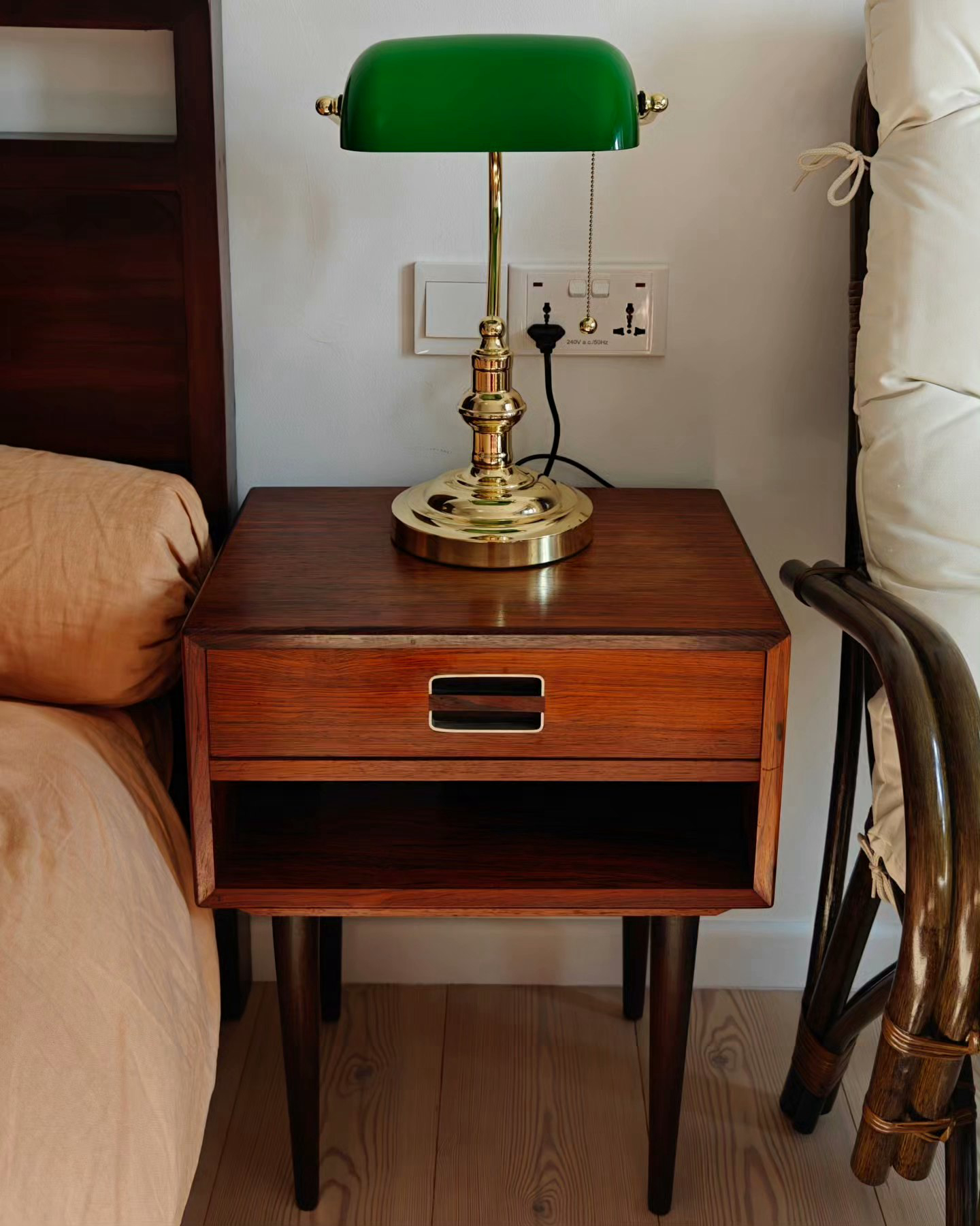 A 3-Gen Scandinavian Home - Green desk lamp, wooden nightstand, beige bed, wooden floor, wooden chair, wooden legs, wooden