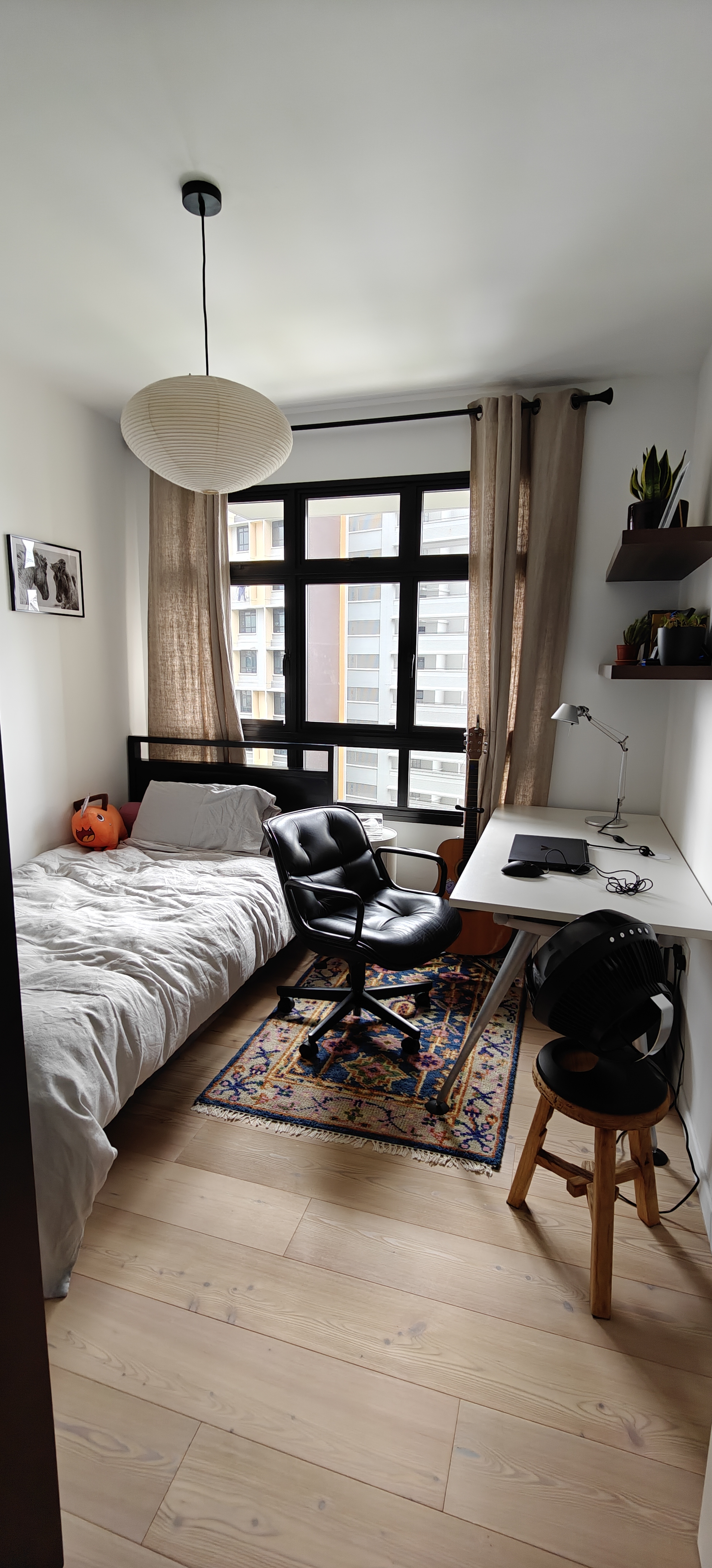 A 3-Gen Scandinavian Home - Modern bedroom with comfortable bed, black office chair, desk with laptop, hanging pendant light