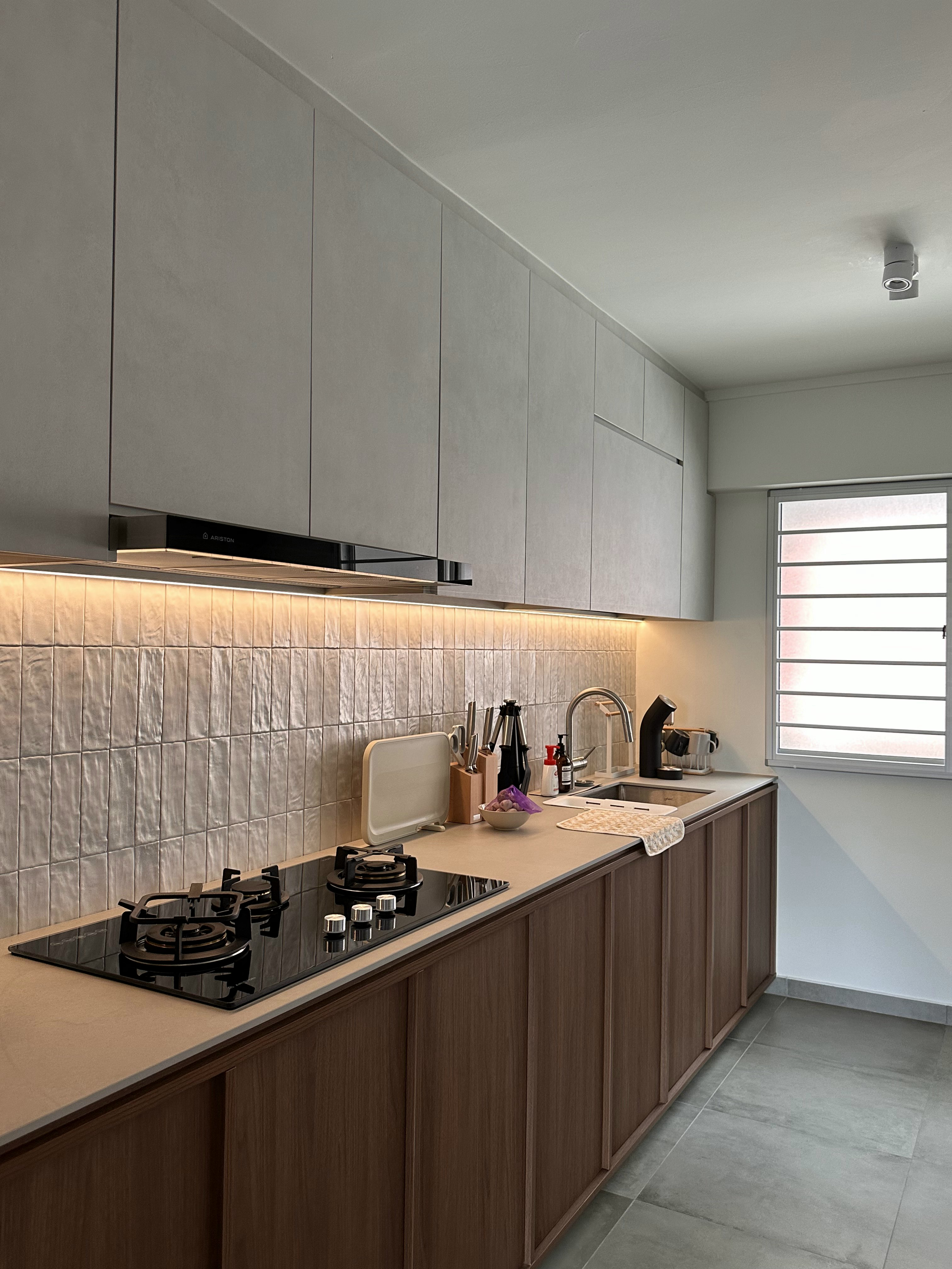 When Industrial meets Wabi-Sabi details within 1593sqft. - Modern kitchen with sleek cabinets, stainless steel appliances