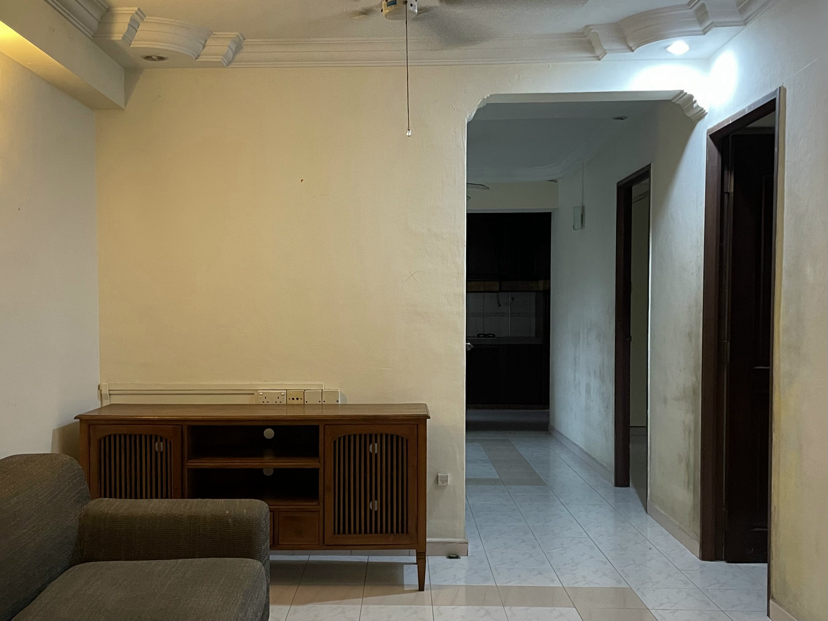 Before & After: Our 5-Room Resale Makeover - Wooden entertainment center, beige walls, recessed ceiling lights, open doorway