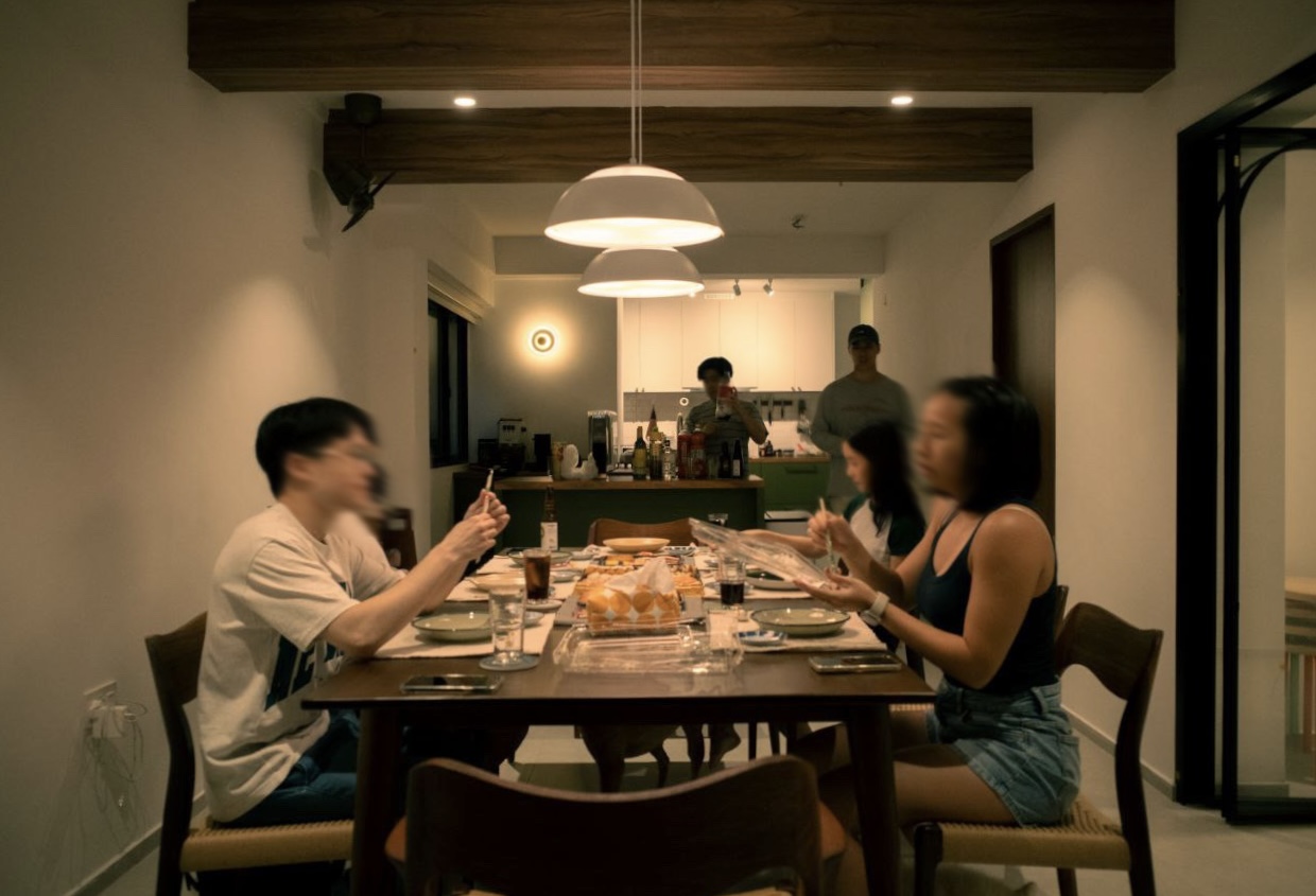 Before & After: Our 5-Room Resale Makeover - Group of people sitting around a dining table, engaged in conversation and