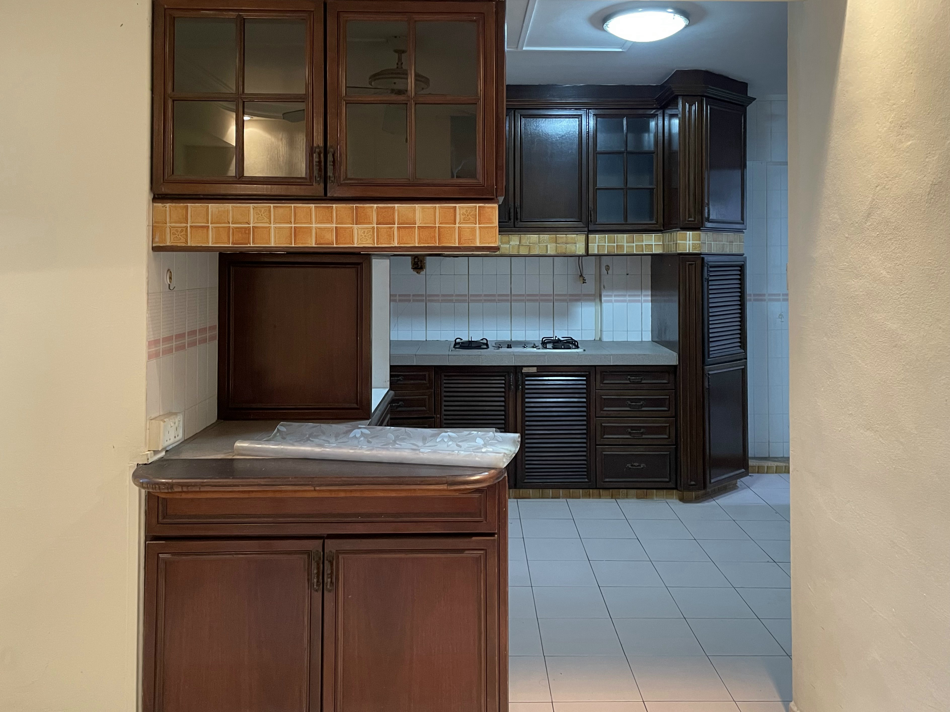 Before & After: Our 5-Room Resale Makeover - Dark wooden kitchen cabinetry, tiled backsplash, gas stove, white tiled floor