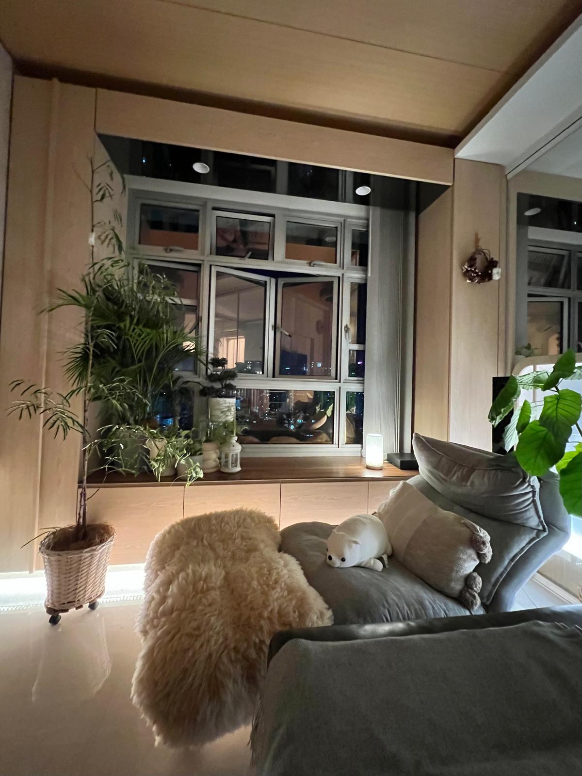 The Power of Lighting | Day and Night View of Living Room - Lush green plants, cozy armchair, fluffy beige rug, soft gray