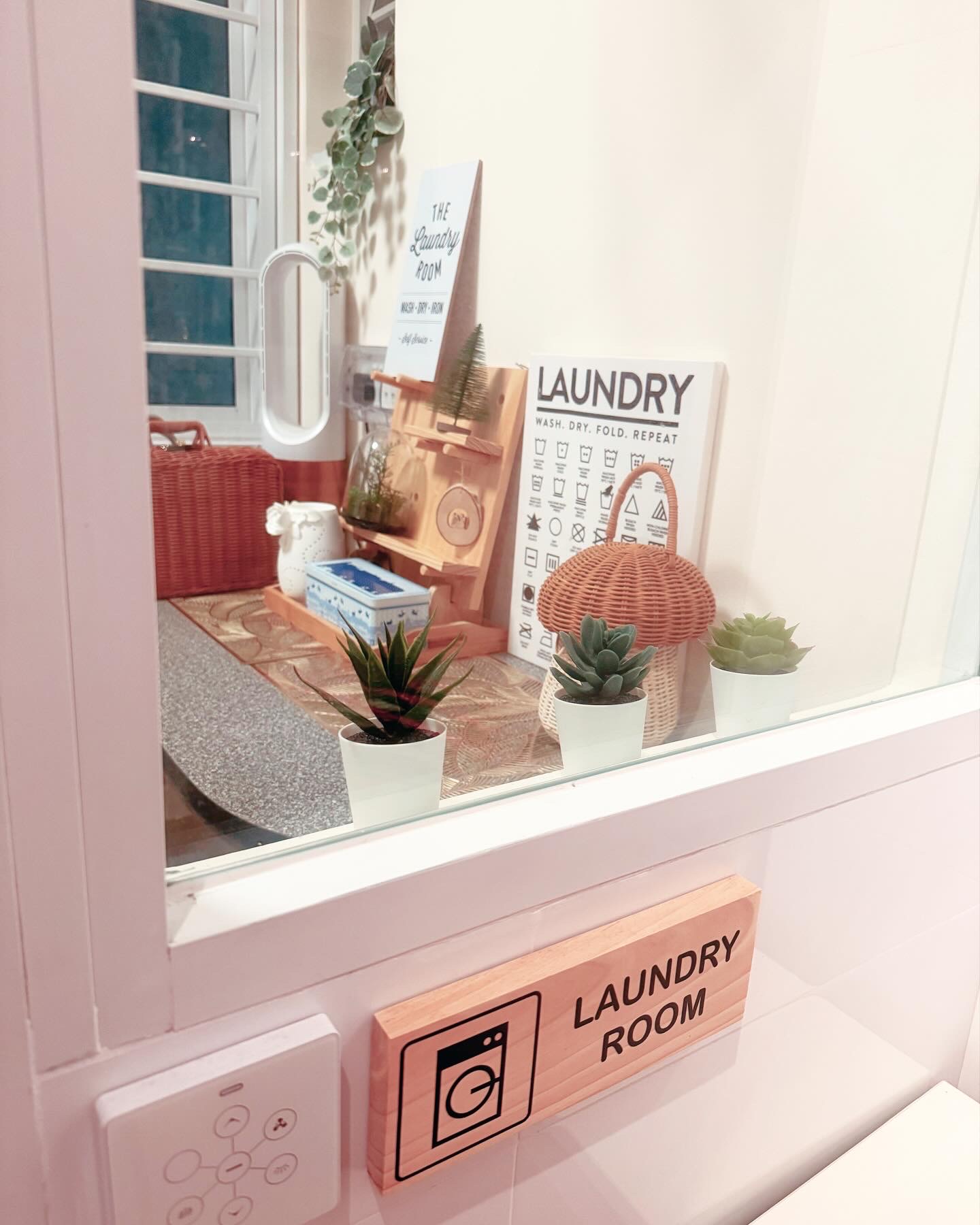 A Dreamy Yard for Laundry - Laundry room, window display, potted plants, minimalist decor, wooden sign, laundry room sign
