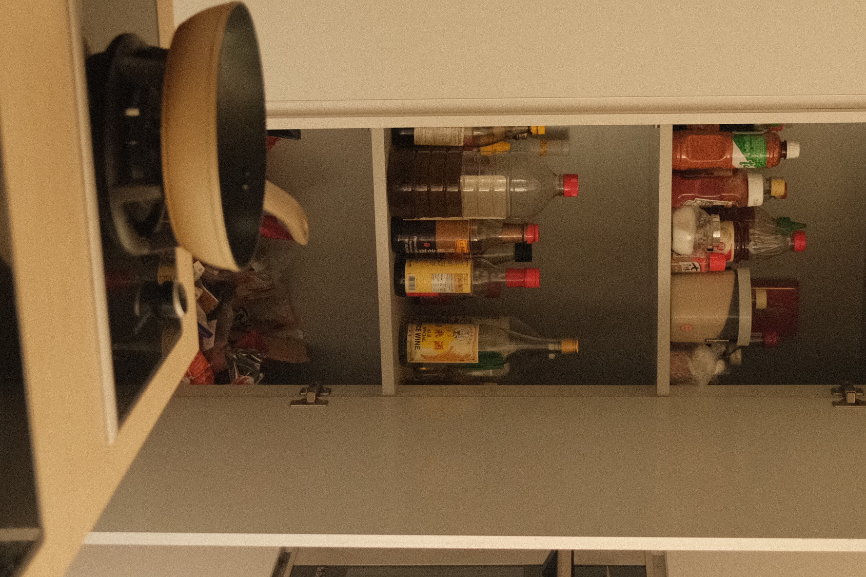 Kitchen Organisation around our Island Kitchen - Bottle of liquor, bottle of soda, bottle of water, bottle of beer, bottle of