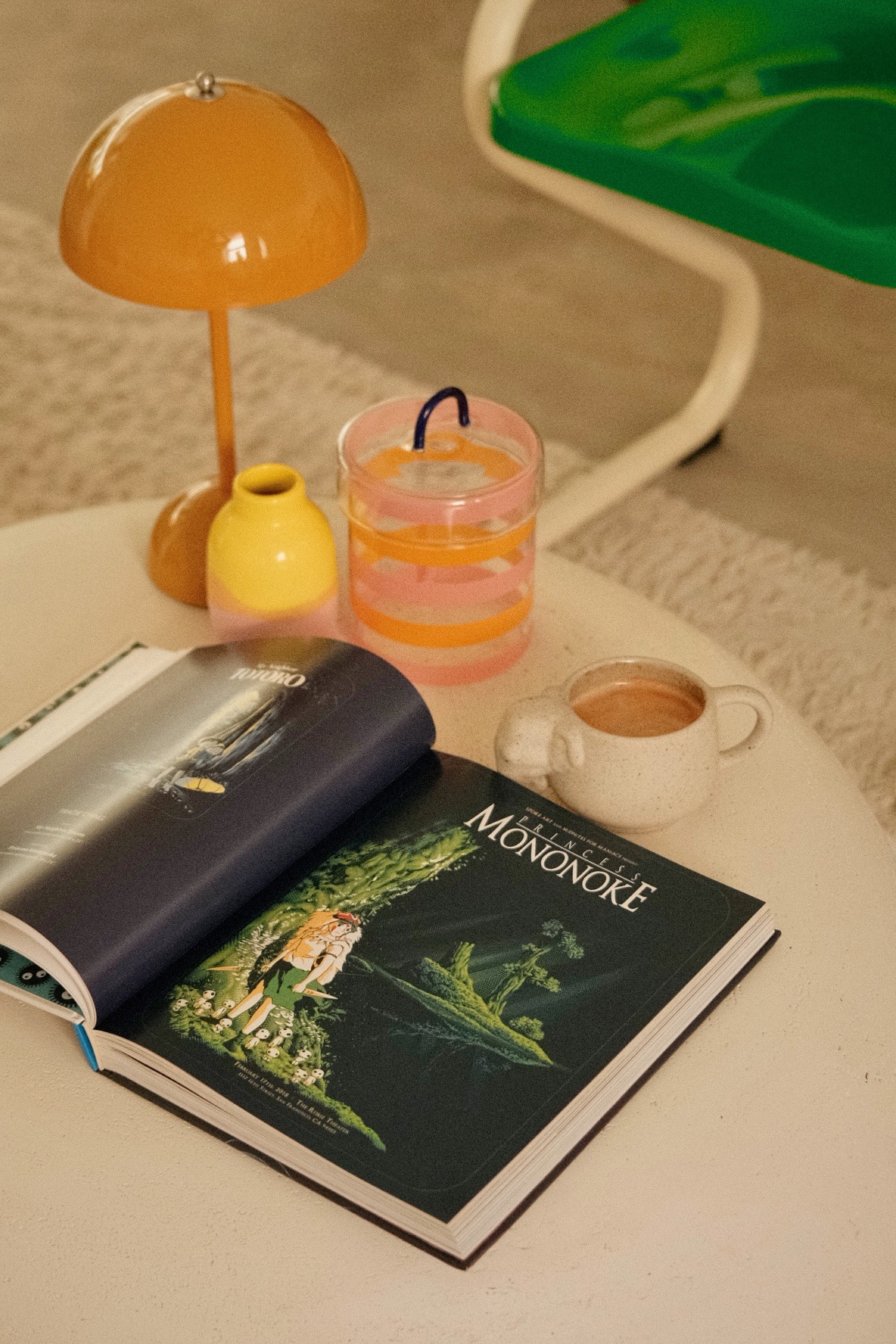 Our thoughts on choosing the right furniture and accessories - Lavender lamp, orange shade, round table, cozy setting, soft