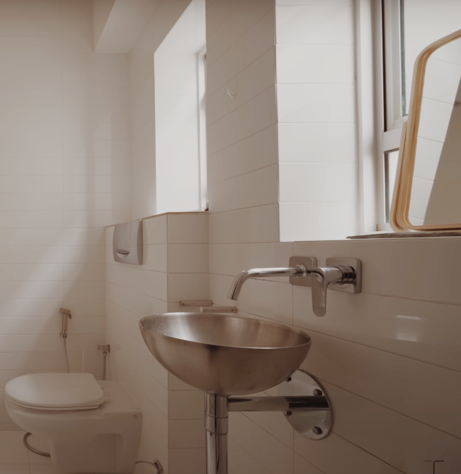 Our simple bathroom in a heritage home - White tiled bathroom, modern fixtures, stainless steel sink, toilet, window with