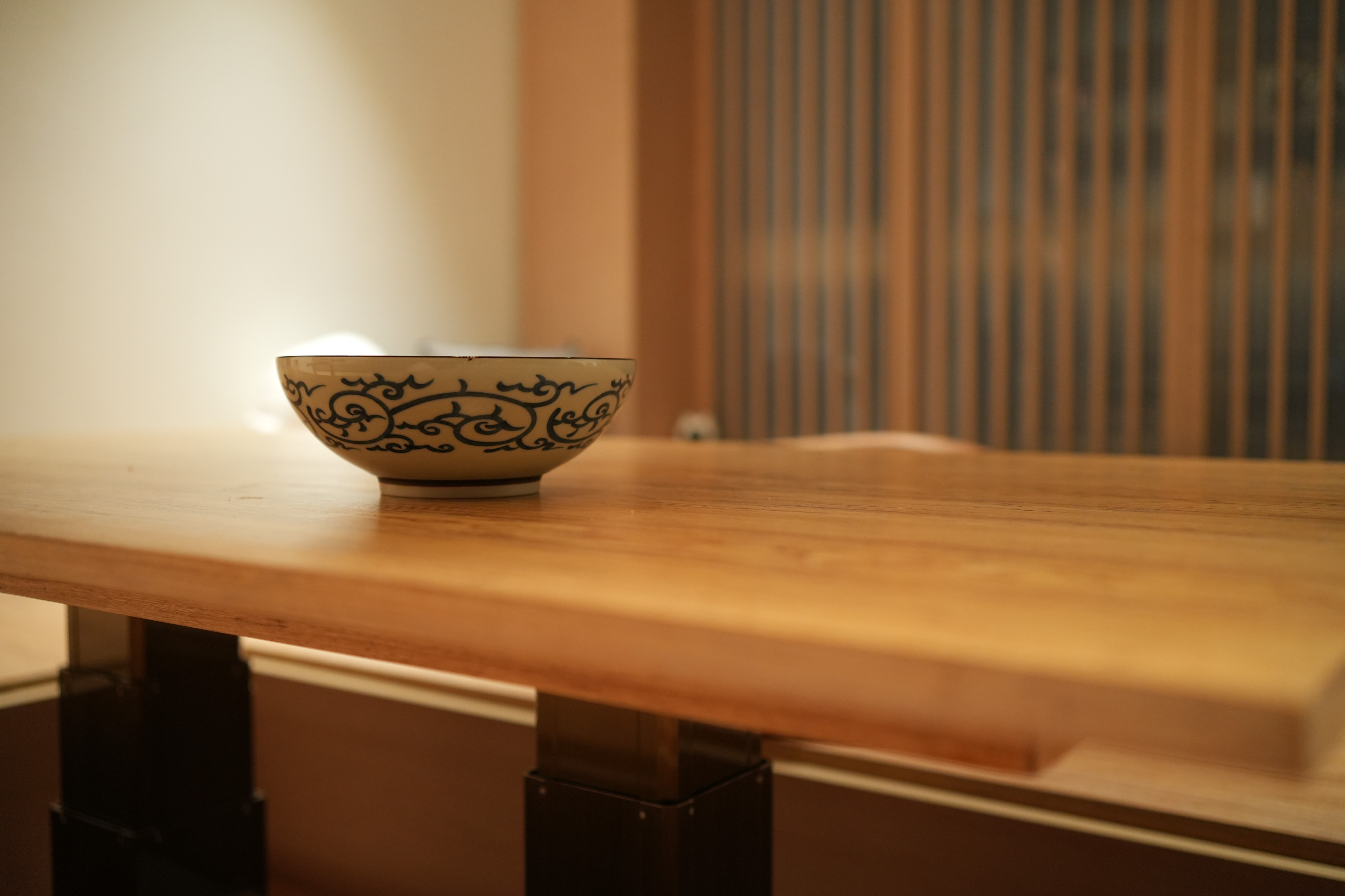 Our Dining Room: Traditional Japanese Washitsu for Modern BTO Living - Bowl, wooden table, intricate design, warm lighting
