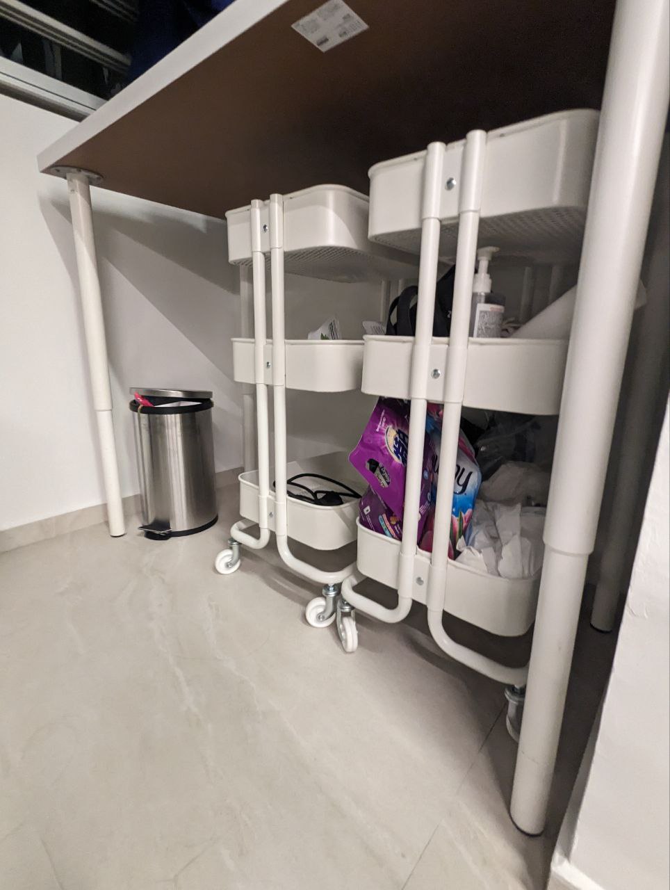 Service yard in the kitchen? - Under-desk cart, white metal frame, rolling wheels, storage bins, laundry detergent, purple